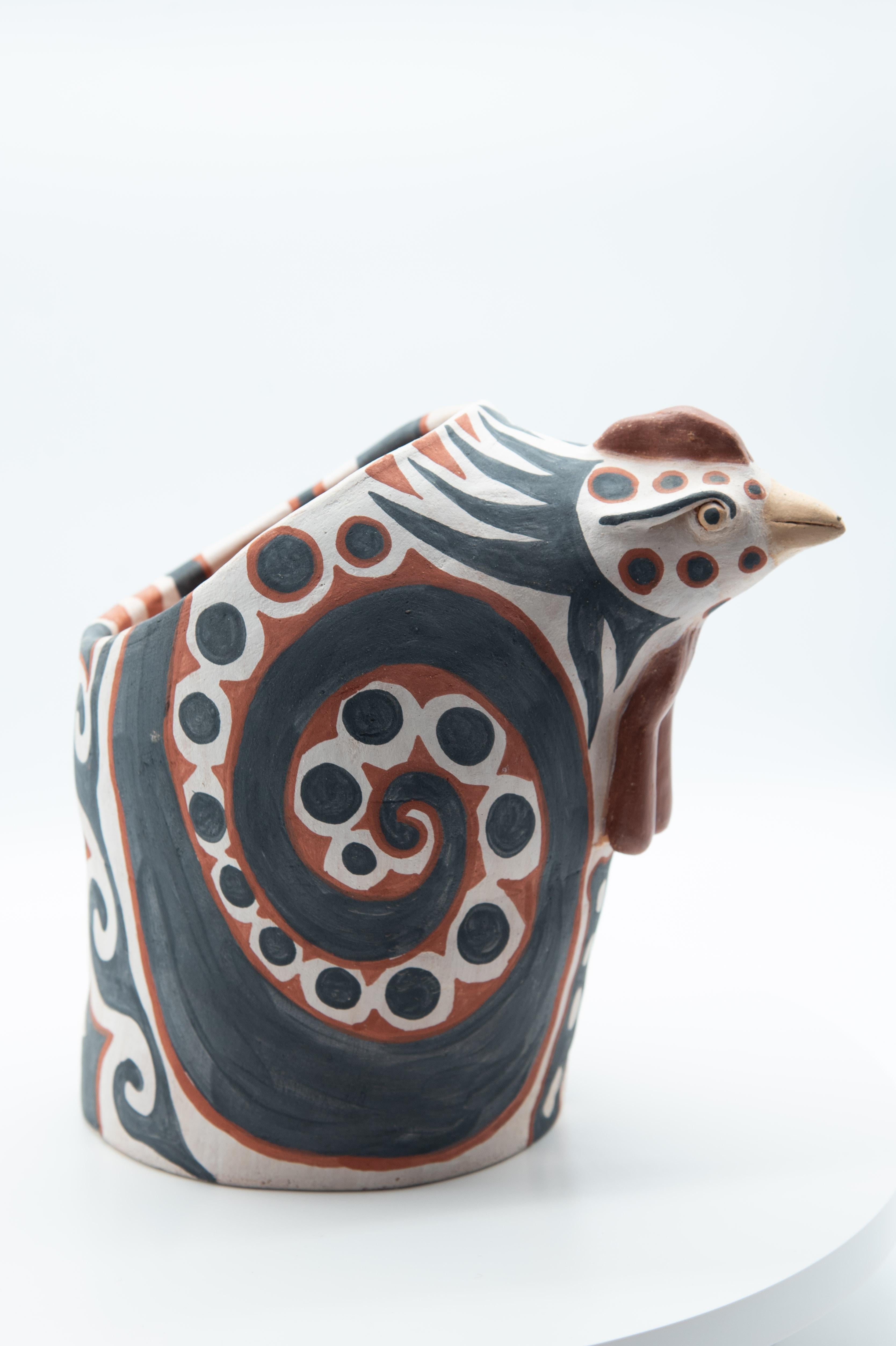 This Mexican ceramic hen is an egg basket, perfect to keep eggs fresh -- a utilitarian kitchen piece by artist Manuel Reyes. Made with clay from Oaxaca and Zacatecas, painted with oxides from the region. Done with the hand-modeled technique and