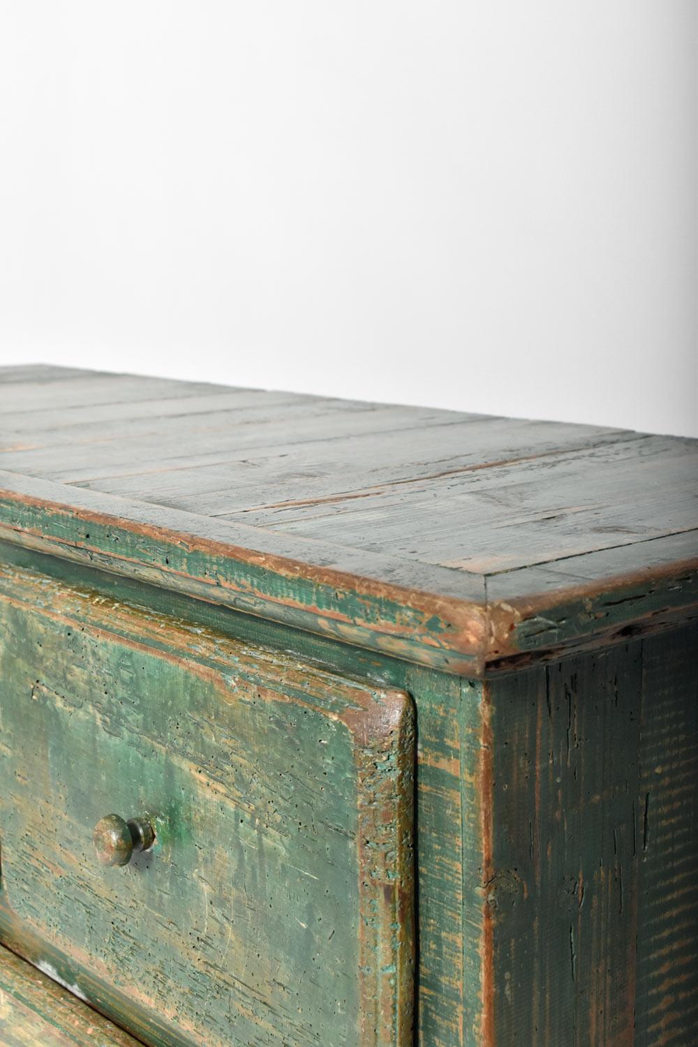 Chest of drawers in patinated wood and painted green opening
front with five drawers. Mexico, 1970s.