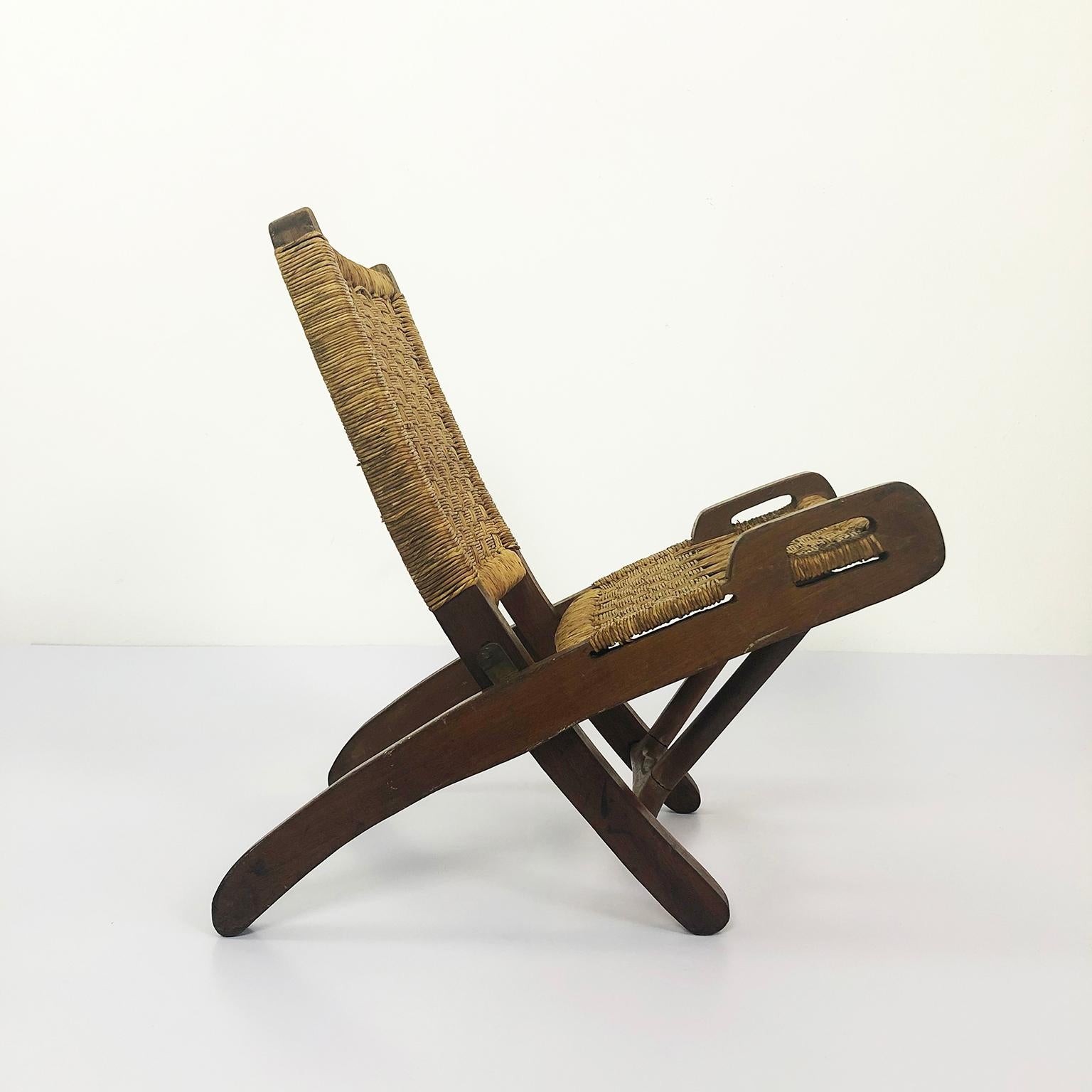 We offer this rare Children Mexican folding chair by Muebles Toluca, circa 1950. Made in primavera wood and natural palm cords.