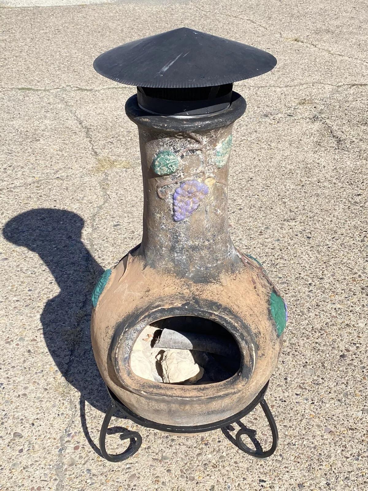 Mexican Chiminea Outdoor Clay Terracotta Fireplace Firepit with Iron Stand. Circa Late 20th Century. Measurements: 47