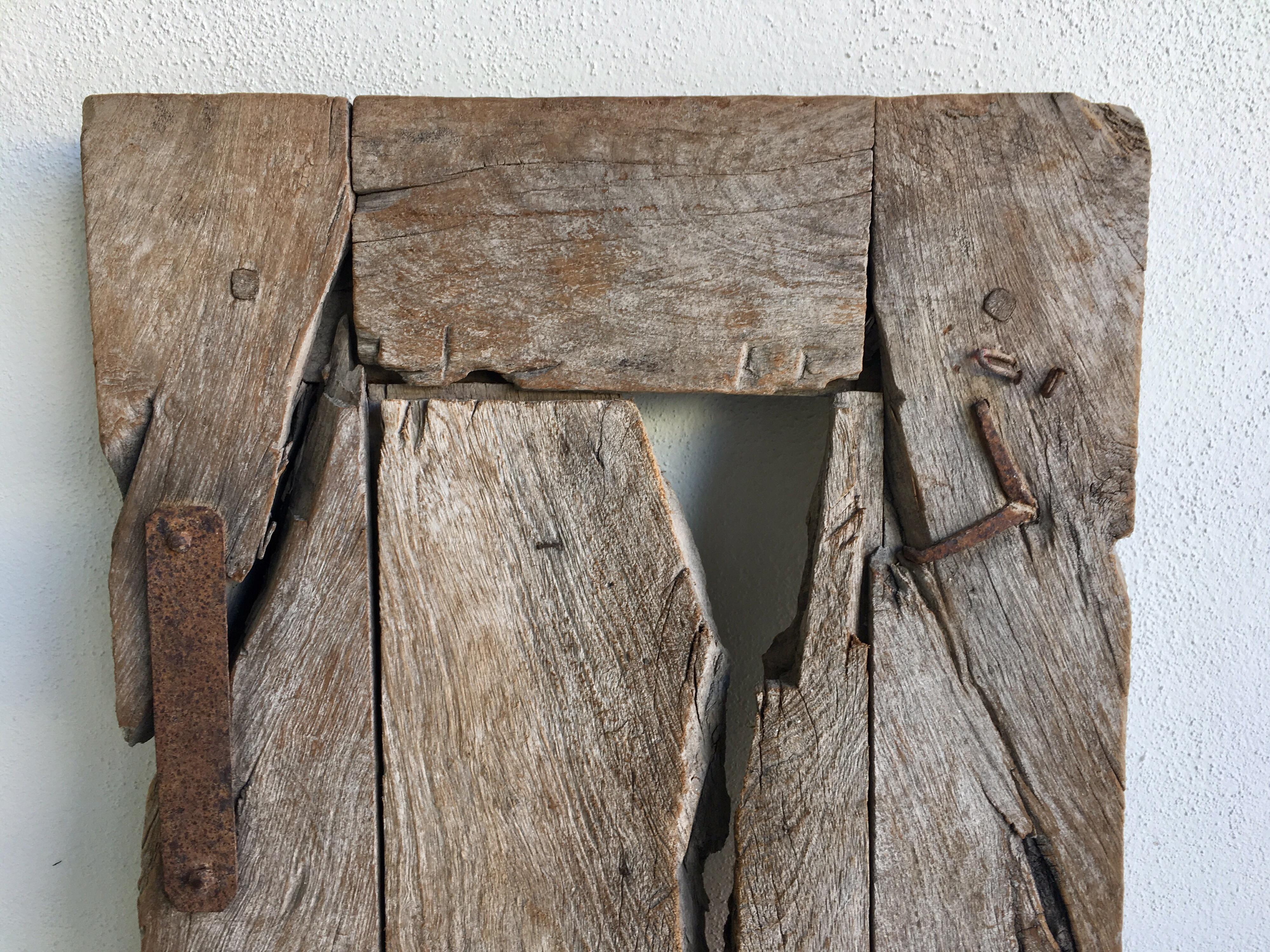 19th century colonial window in mesquite wood from the Sierra Gorda region of guanajuato. Original iron hardware with lock mechanism and hand forged iron nails, circa mid-1800s.