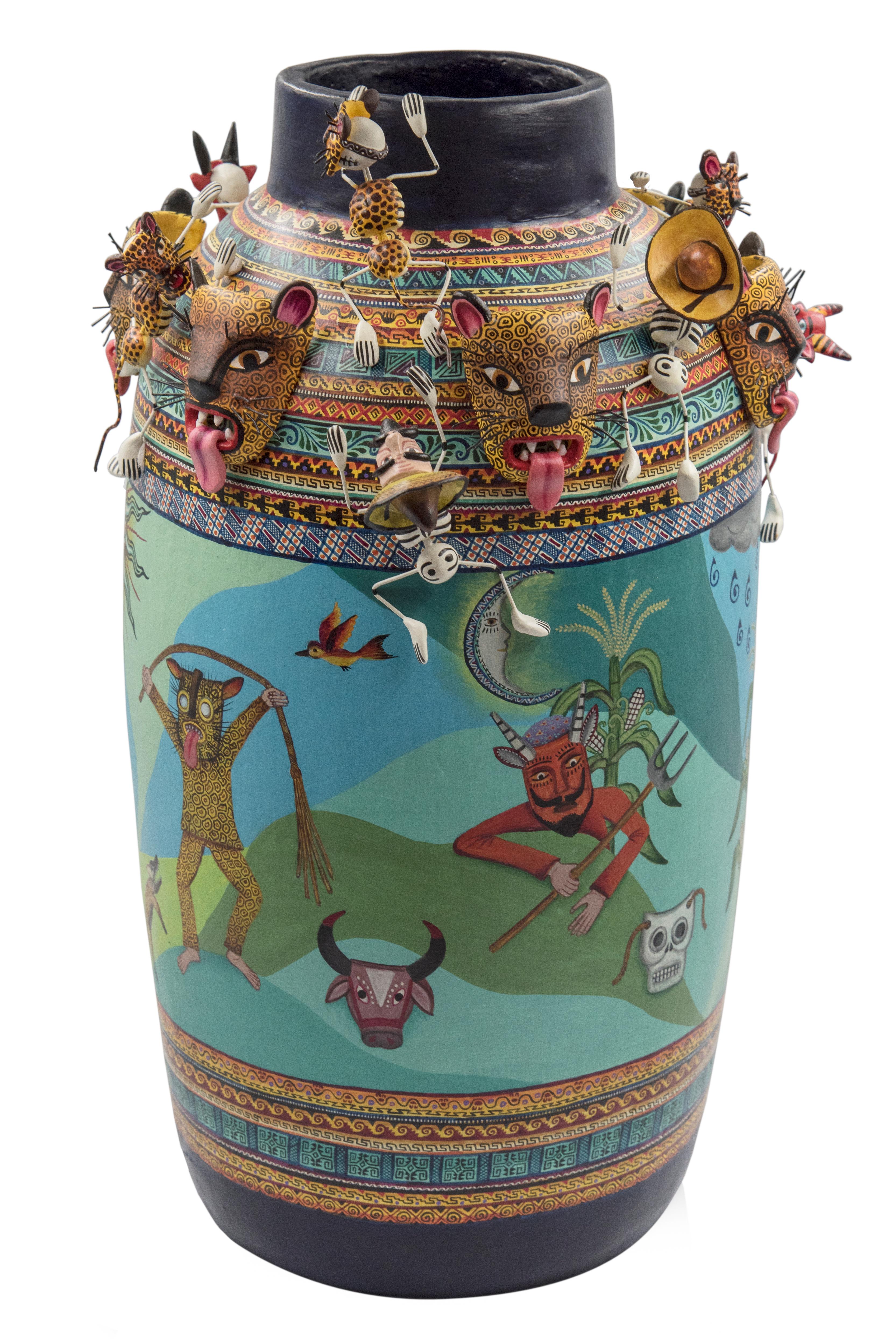 Beautiful Mexican ceramic vase made with cooked clay and decorated with acrylic paint.

The vessel represents the traditional dance for the good harvest and fertility, practiced still in some small Mexican towns. One of the main characters in the