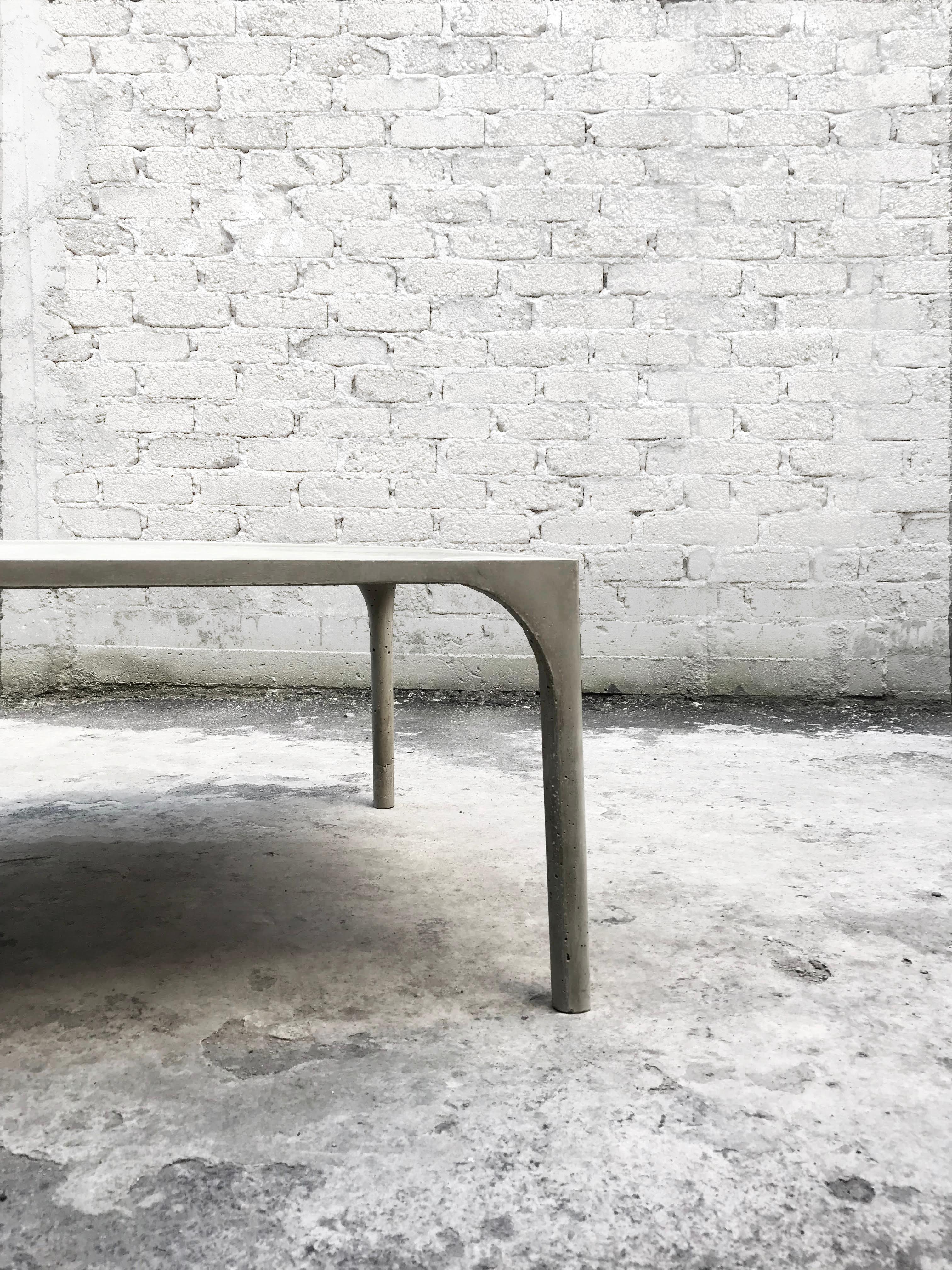 Mexican contemporary design one-piece concrete center table, an organic, light and resistant concrete piece. A collaboration with MDC.