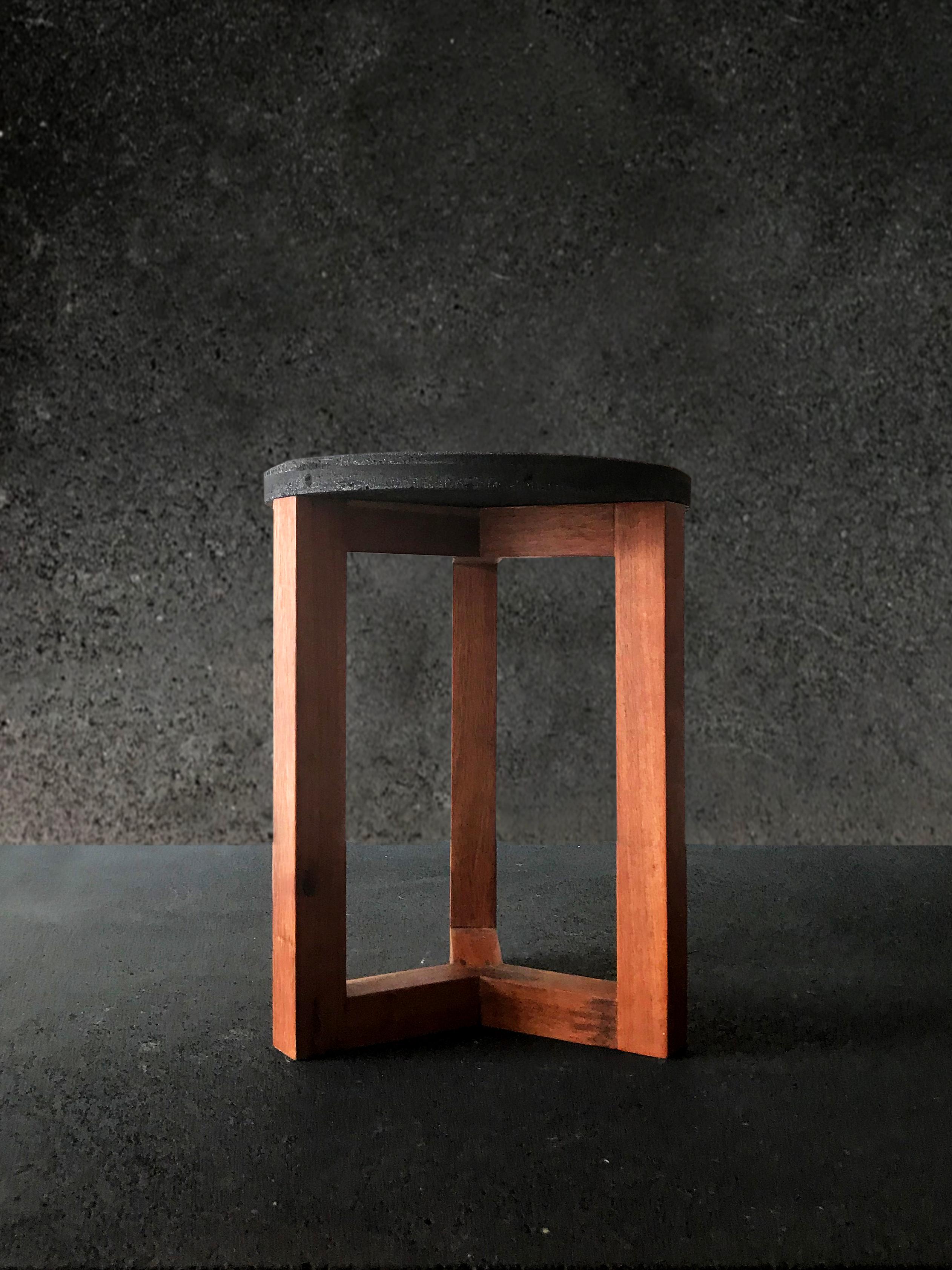 Mexican contemporary design wood and concrete stool. The versatility of this piece allows the stool to be used both for seating or as a lateral table. A collaboration with MDC.
