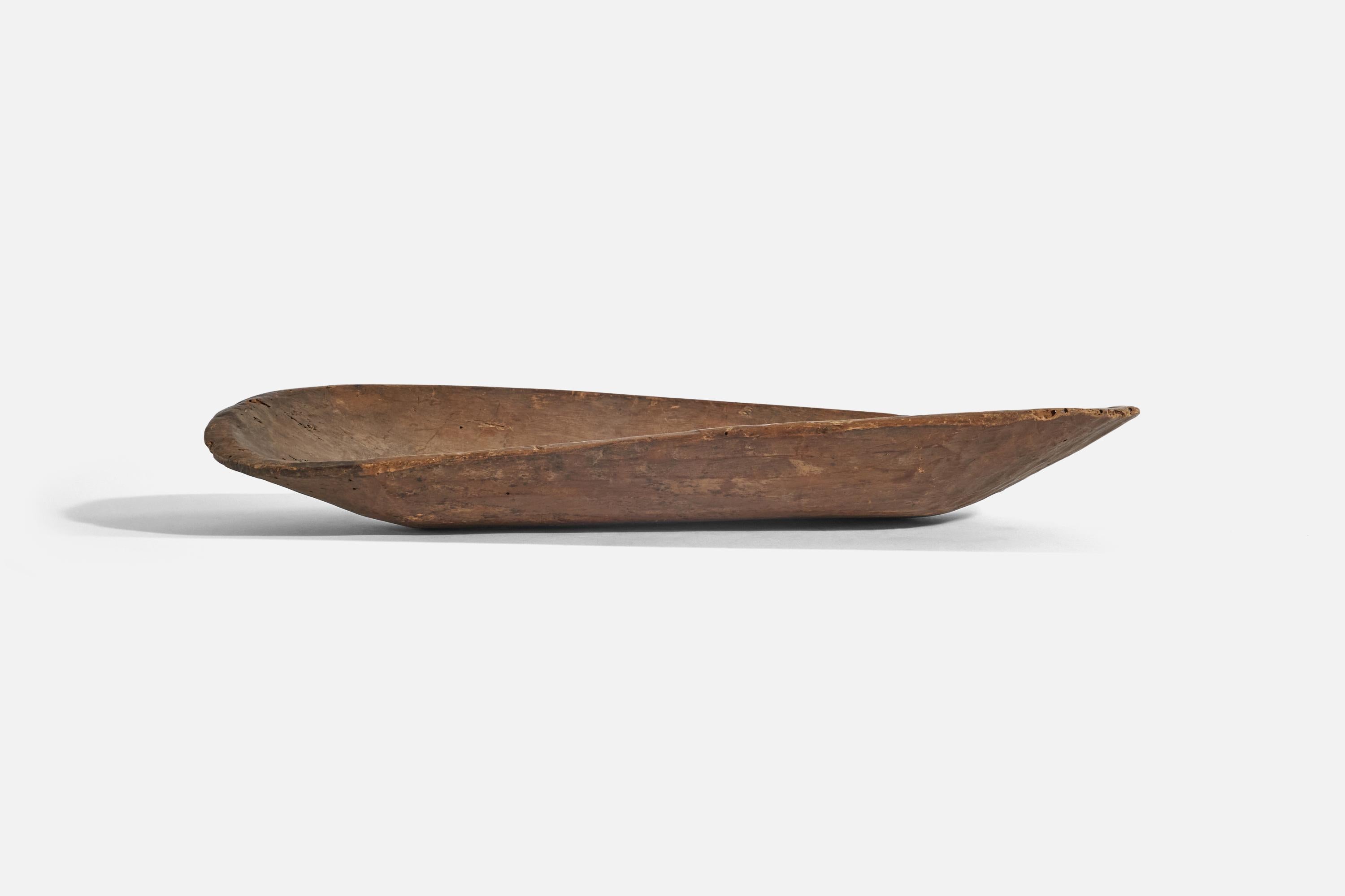 A wooden bowl or poche-vide designed and produced in Mexico, early 20th century.