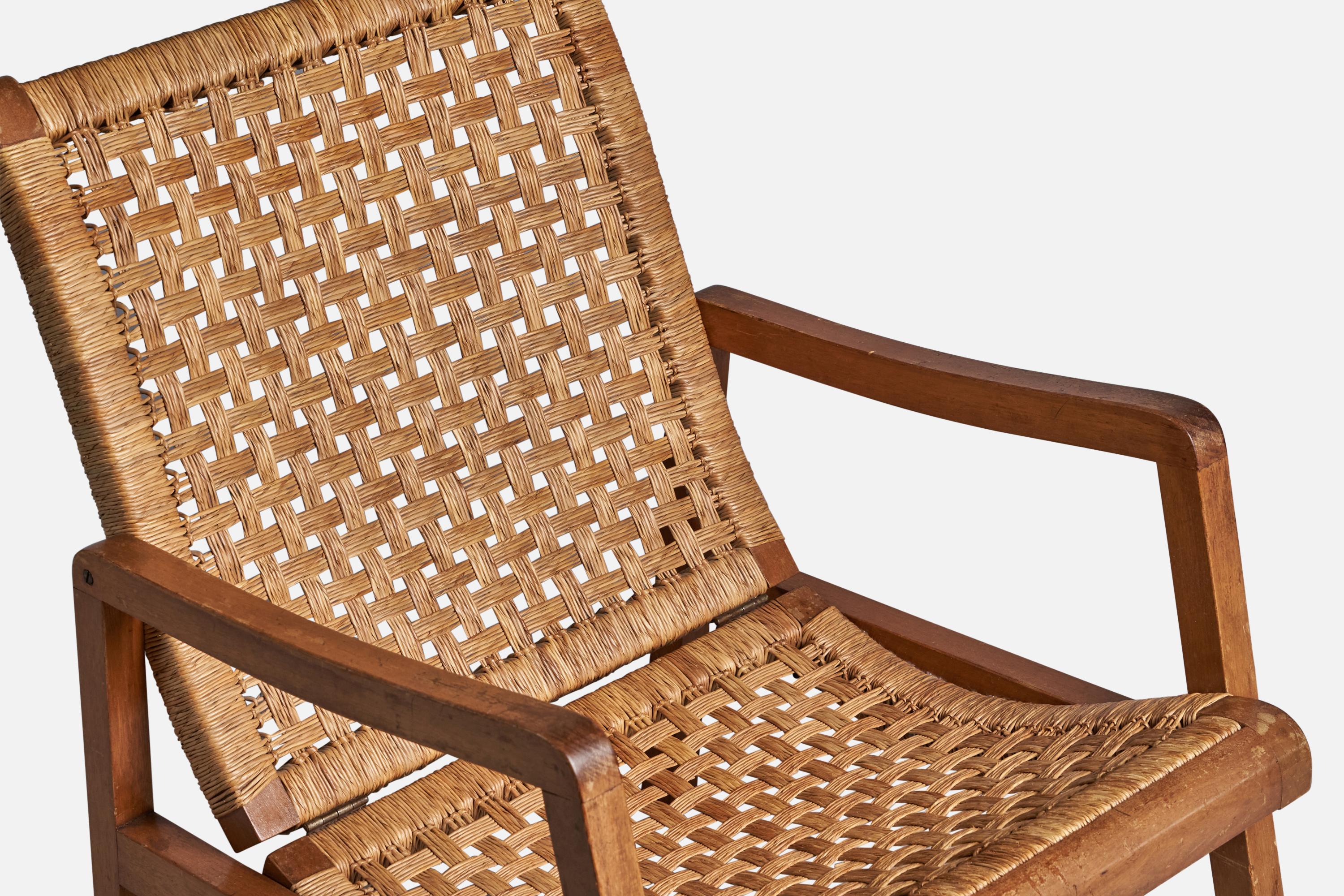 A cane and oak lounge chair designed and produced in Mexico, c. 1950s.
11” seat height