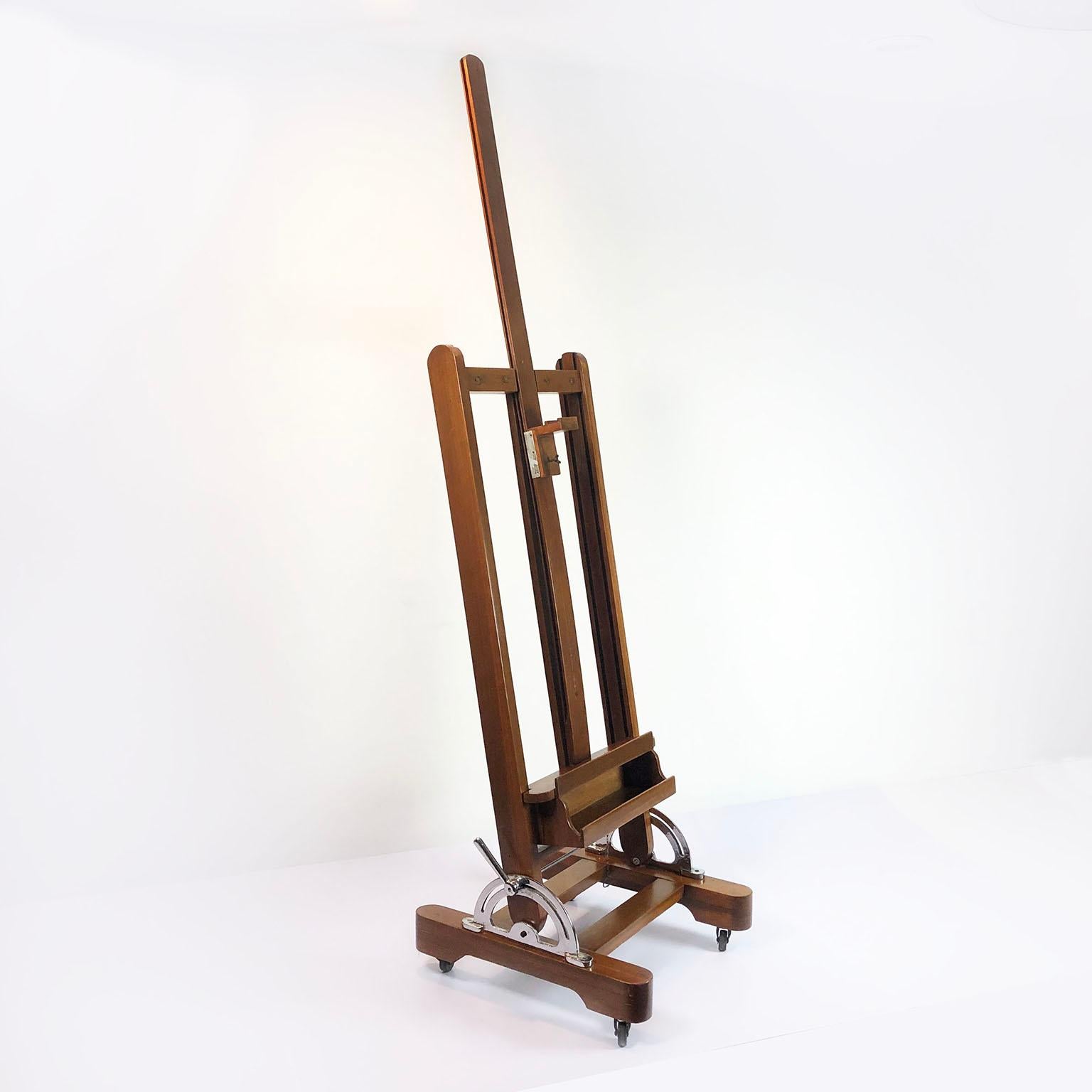 We offer this Mexican wooden adjustable artist easel, circa 1950. This easel has the same design as those currently in the study of Diego Rivera and Frida Kahlo with 4 wheels, recently restored, ready for the next Frida Kahlo! Height is adjustable.