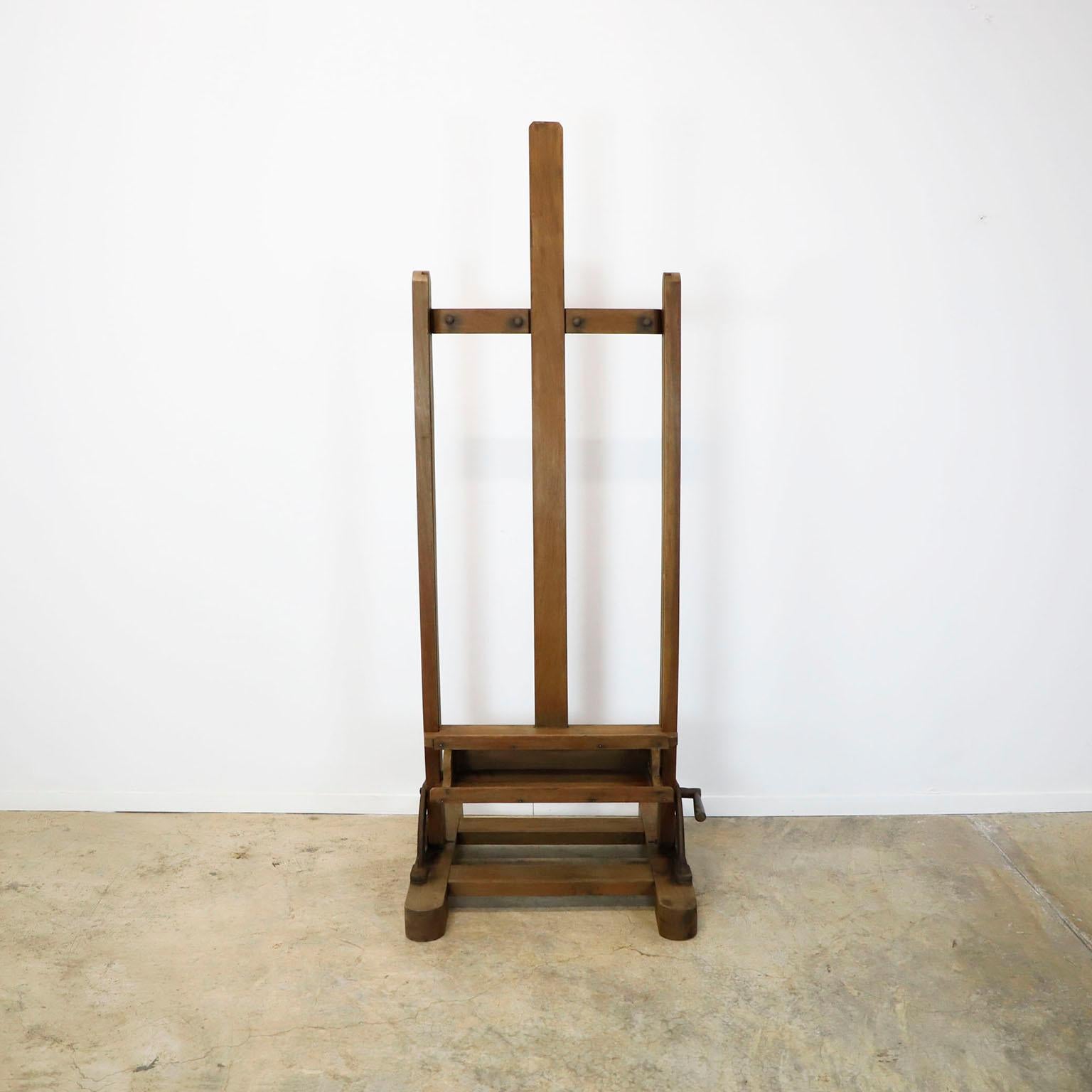 A Mexican wooden adjustable artist easel, circa 1950. This easel has the same design as those currently in the study of Diego Rivera and Frida Kahlo, has a nice old patina, with remnants of artistic creations of past, standing tall, ready for the