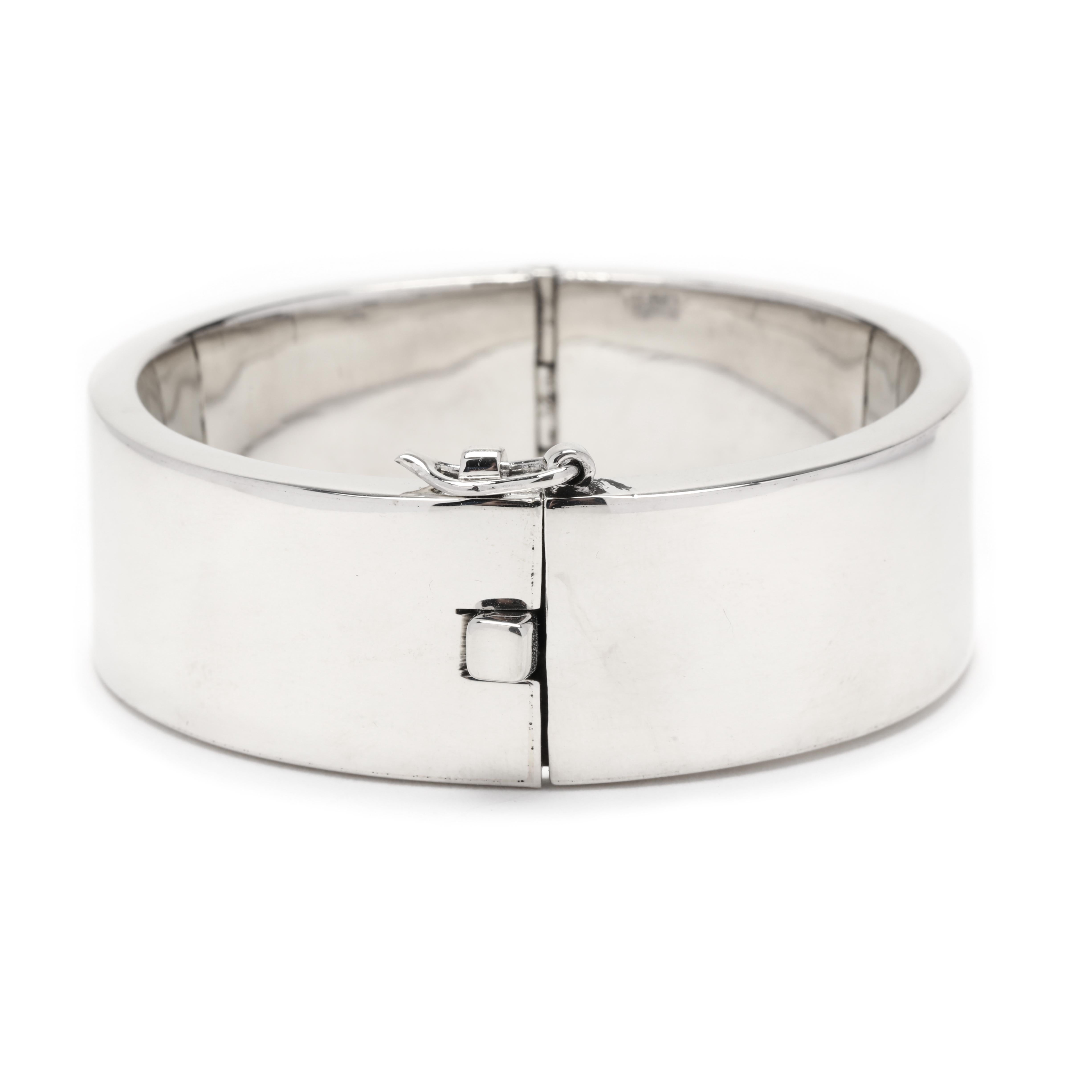 This sterling silver Mexican Escorcia Wide Hinged Bangle Bracelet is a timeless and classic piece that will never go out of style. It's 7 inches in length, making it the perfect size for everyday wear. The simple and plain design of this bangle