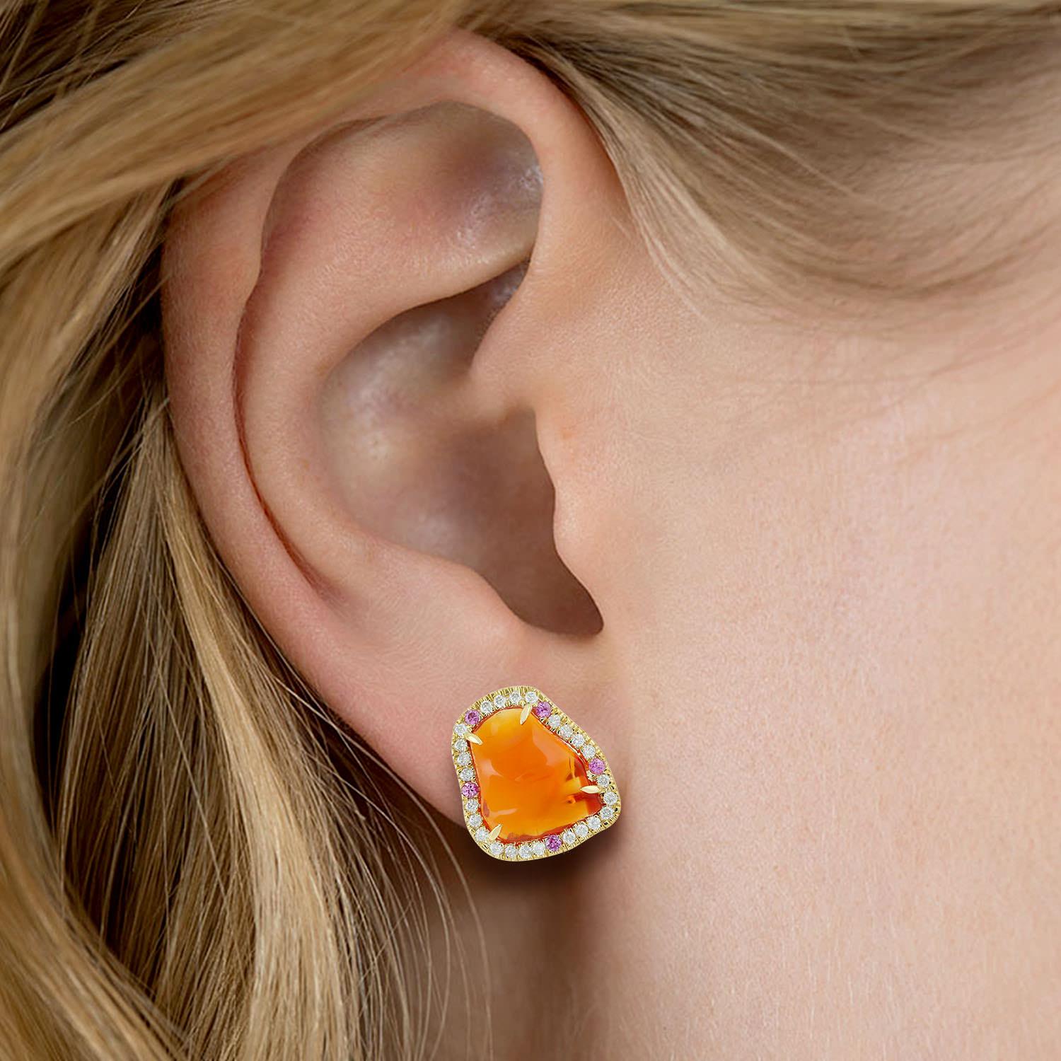 Cast in 18 karat gold. These stunning stud earrings are hand set in 5.46 carats fire opal, .14 carats sapphire and .35 carats of sparkling diamonds.

FOLLOW  MEGHNA JEWELS storefront to view the latest collection & exclusive pieces.  Meghna Jewels