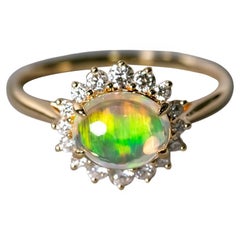 Anello di fidanzamento messicano con opale di fuoco e diamanti a raggiera in oro giallo 18 carati