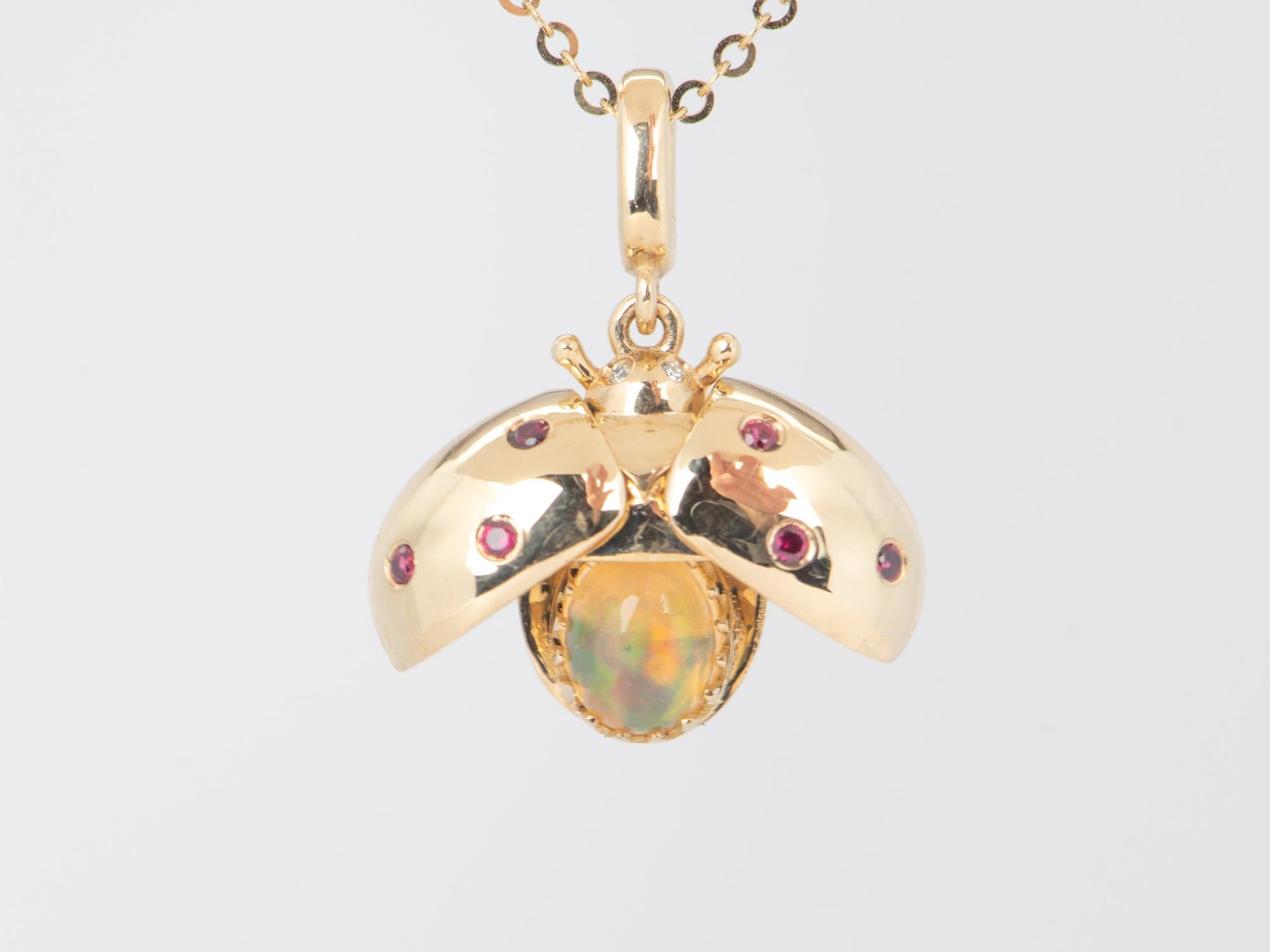 ♥ The cute ladybug has wings that can open to reveal a stunning Mexican fire opal full of rainbow flashes.
♥ The spots on the wings are made from rubies. The eyes are natural diamonds.
♥ The charm is 