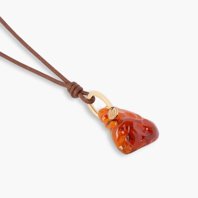 Mexican Fire Opal Necklace in 18k Yellow Gold

A bright fire opal, sourced from Mexico, is captured on an 18k yellow gold loop, allowing the raw and organic beauty of the stone to be admired from all angles. An eye-catching, dynamic stone, believed