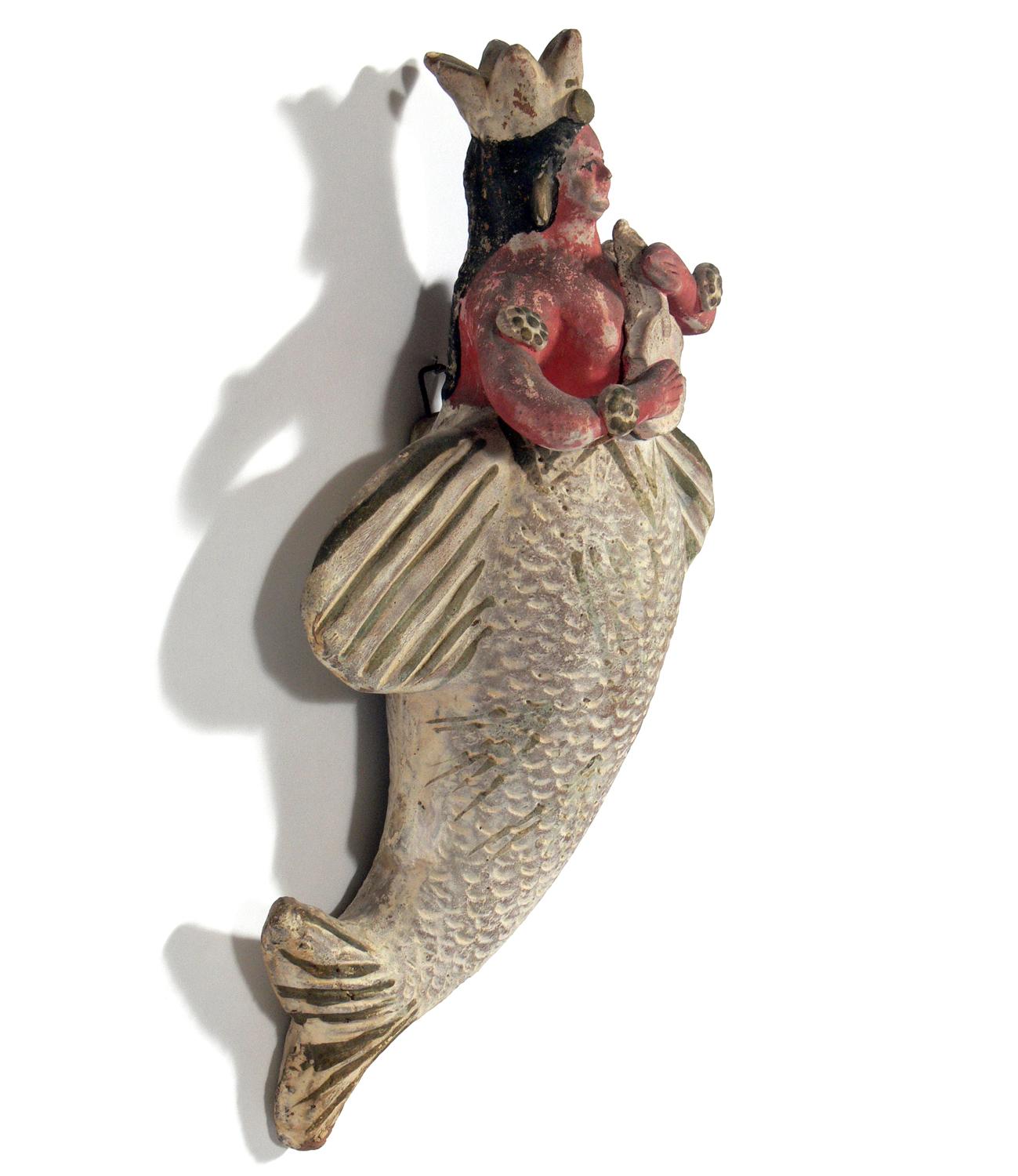 Mexican Folk Art ceramic mermaid, Mexico, circa 1940s-1950s. It retains it's wall hook on the back for easy mounting.