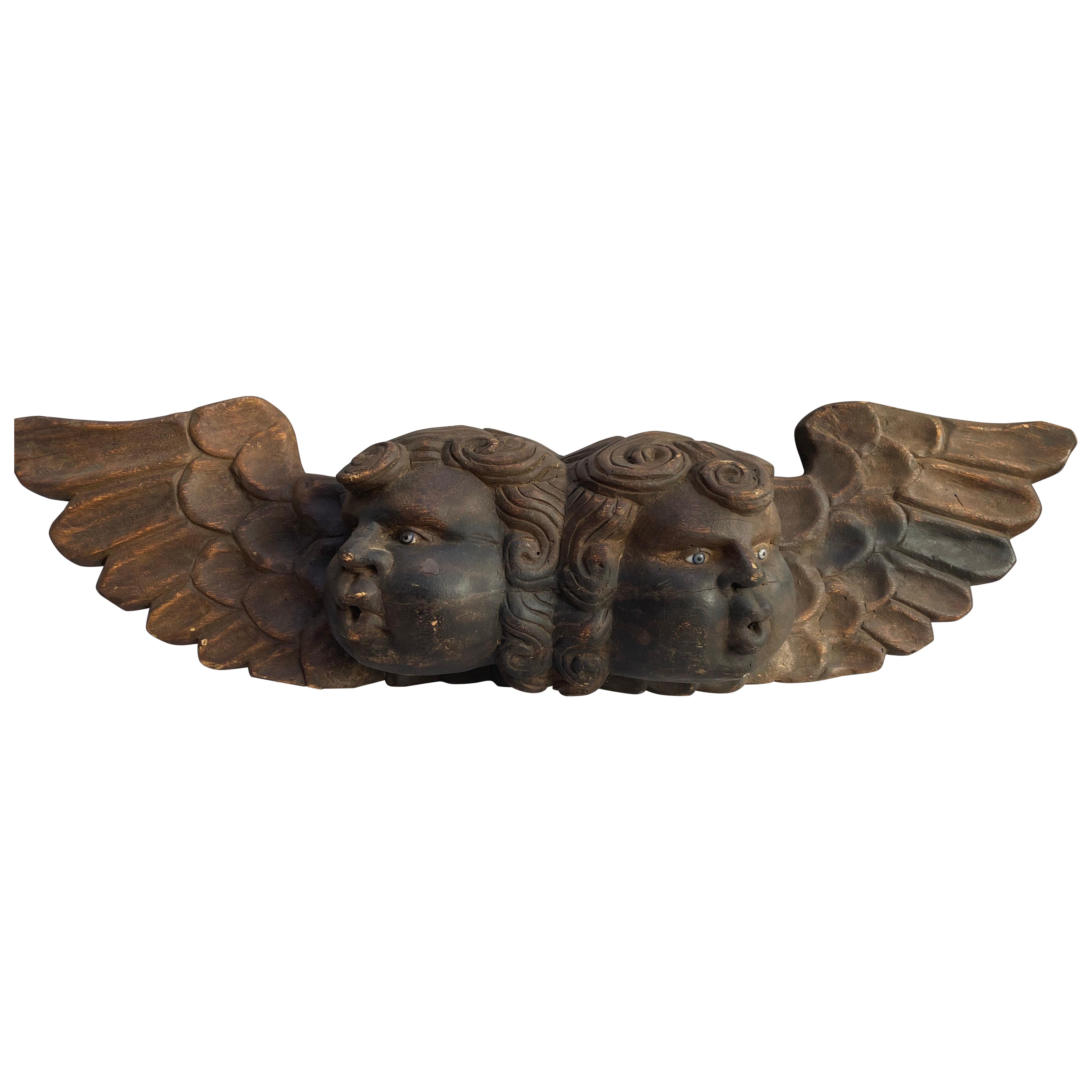 Art populaire mexicain Double chérubin sculpté en bois polychrome en vente