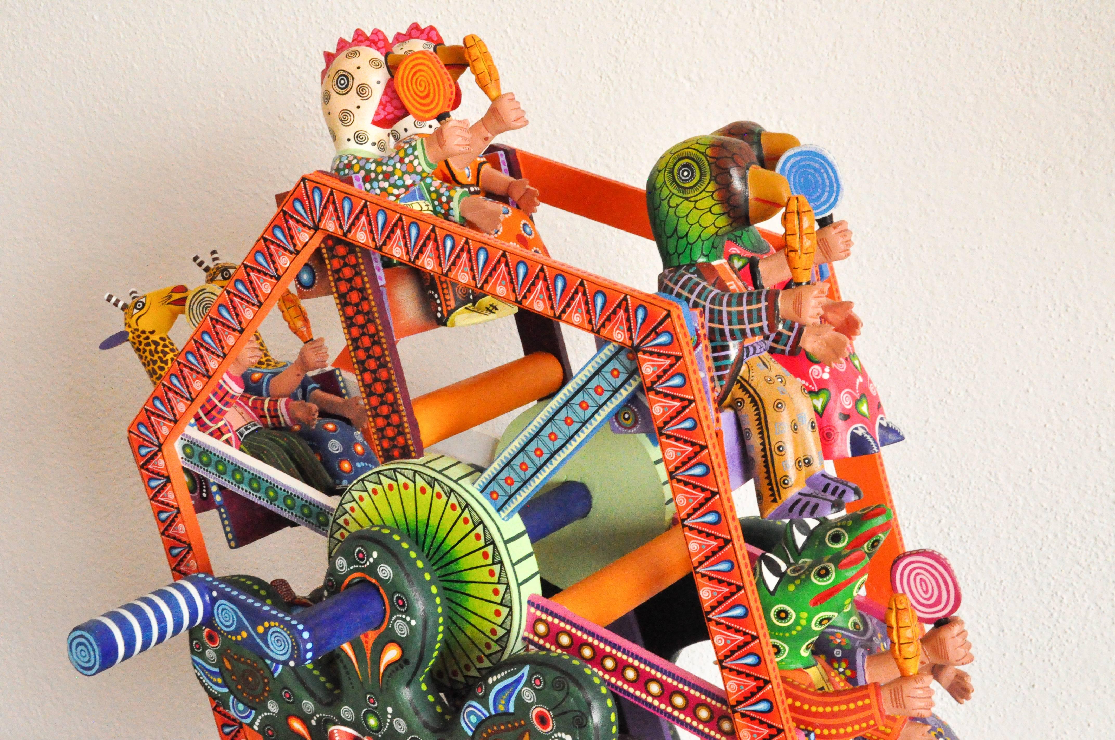 This colorful fortune wheel alebrije is made by Agustín Cruz Tinoco in Oaxaca Mexico. 

“I came up with the idea as a toy for children,” says Mexican master wood carver Agustin Cruz Tinoco.

As Mr. Agustin watches children and their imaginations run