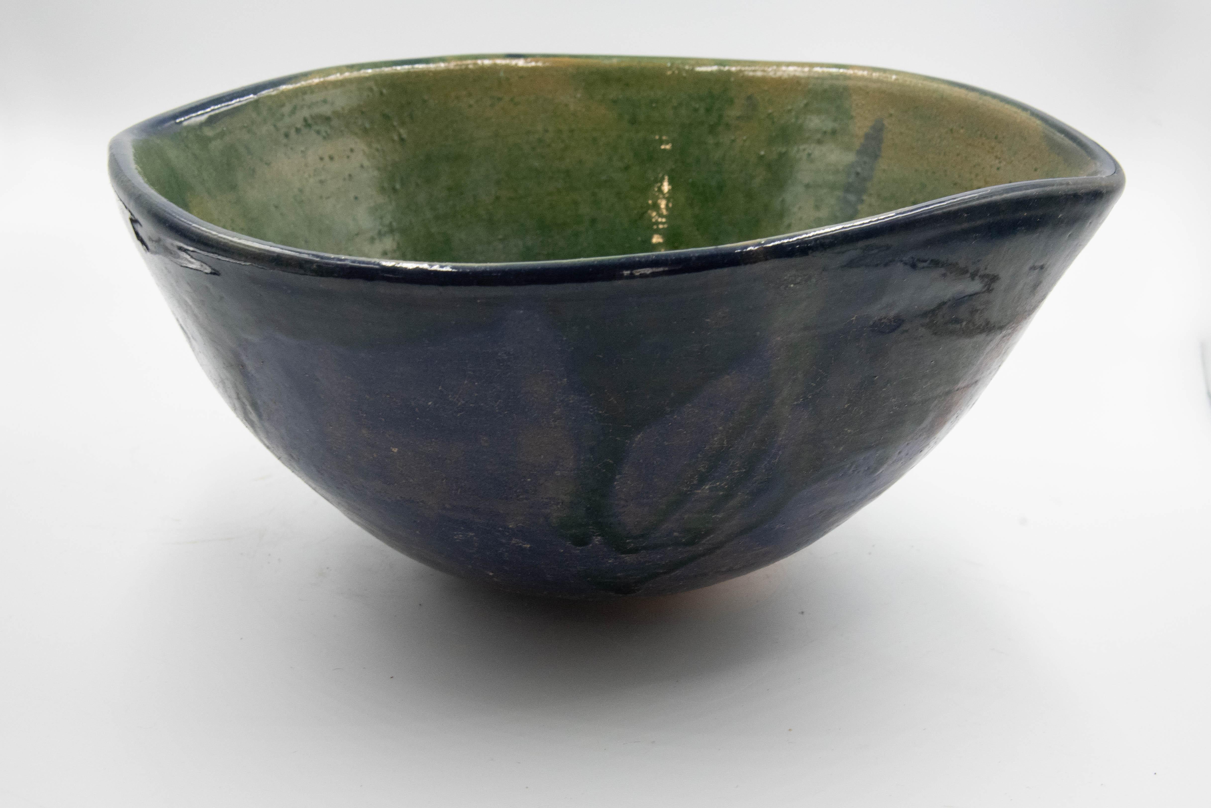 This beautiful rustic pottery bowl is made by Rolando Regino Porras, son of famous Mexican potter Dolores Porras, in Santa Maria Atzompa, in the state of Oaxaca, Mexico. 

Dolores made a great innovation by converting a utilitarian object at that