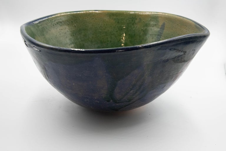 This beautiful rustic pottery bowl is made by Rolando Regino Porras, son of famous Mexican potter Dolores Porras, in Santa Maria Atzompa, in the state of Oaxaca, Mexico. 

Dolores made a great innovation by converting a utilitarian object at that