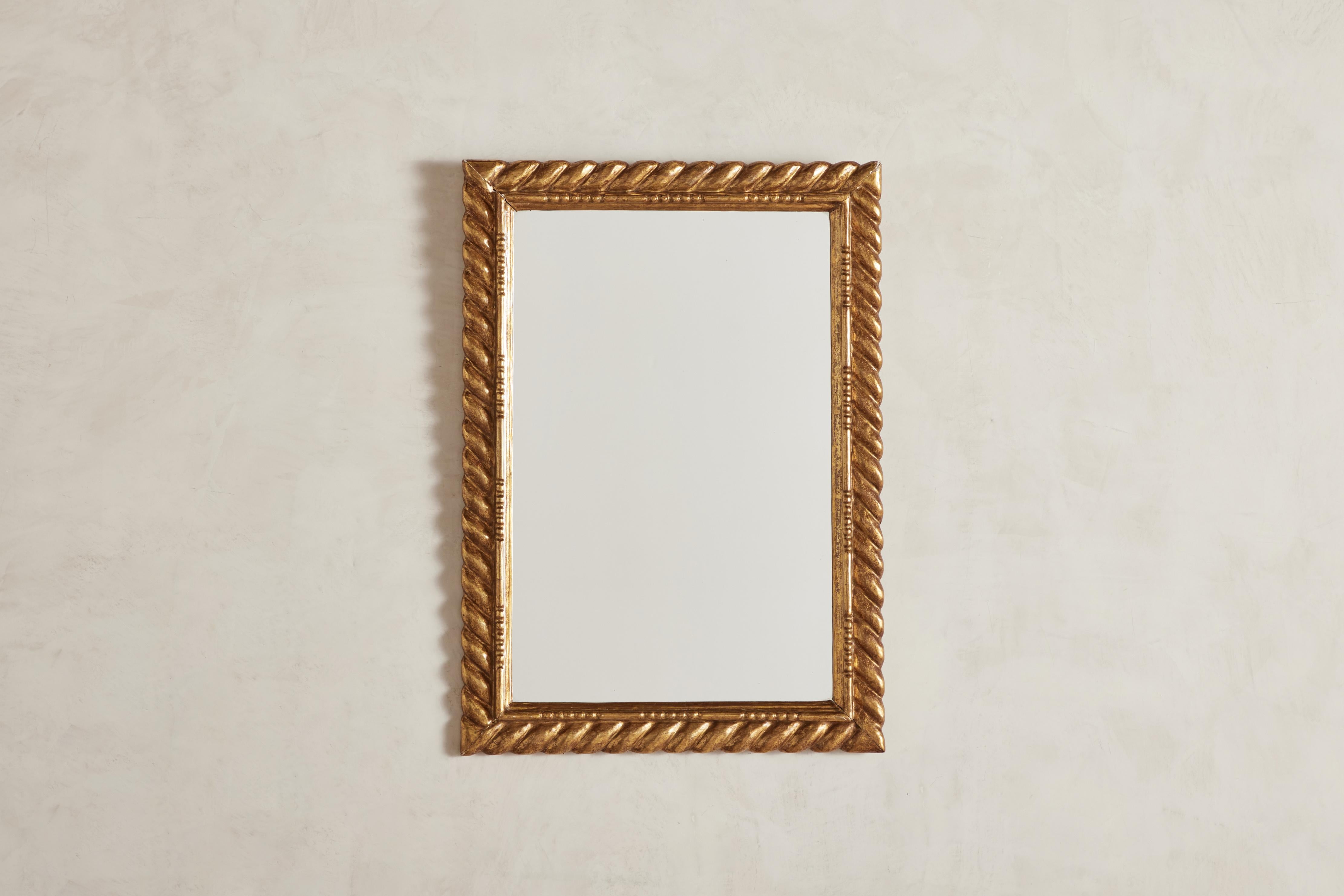 Ornate gold leaf Colonial Revival wall mirror from Mexico circa 1960.