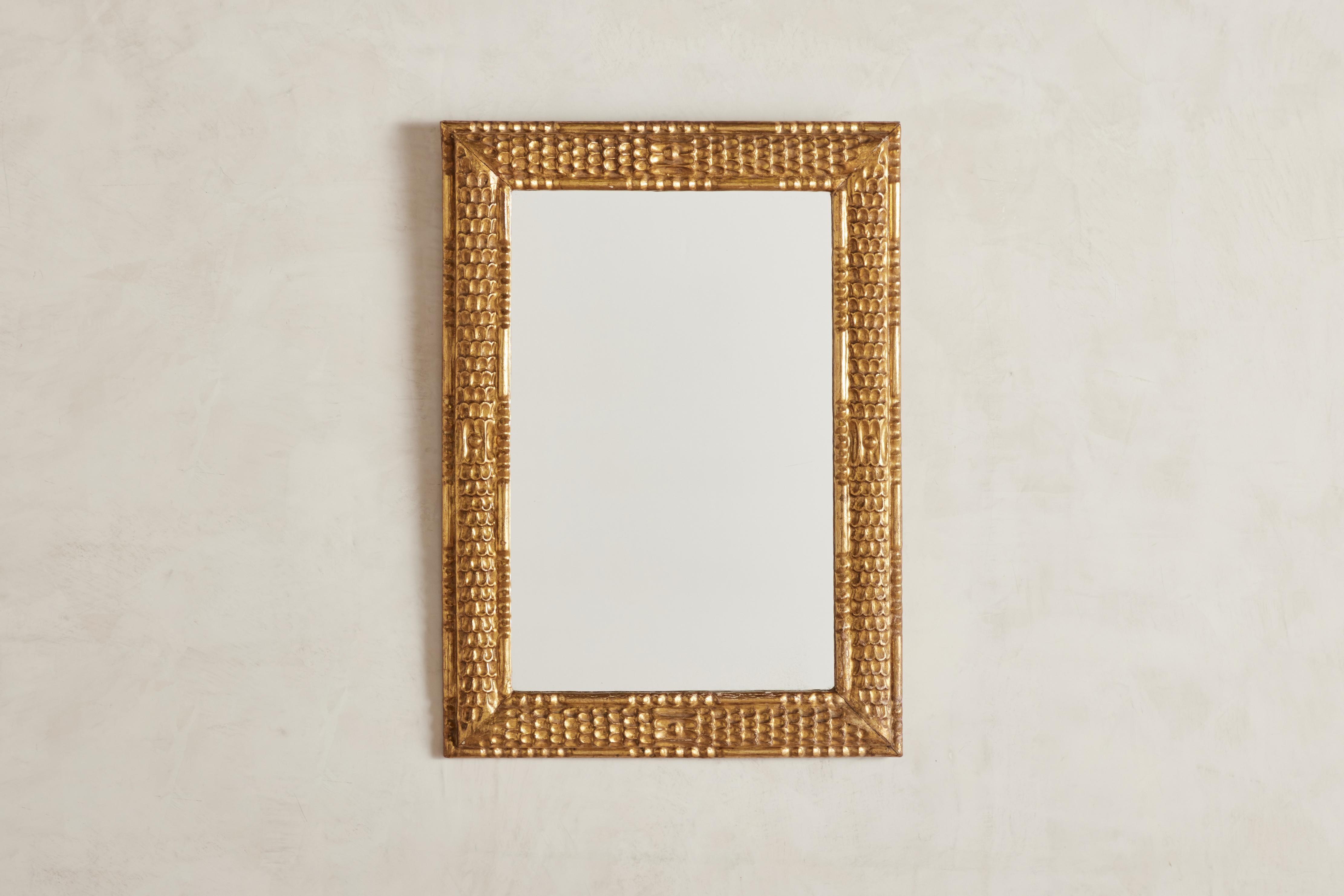 Ornate gold leaf Colonial Revival wall mirror from Mexico circa 1960. 