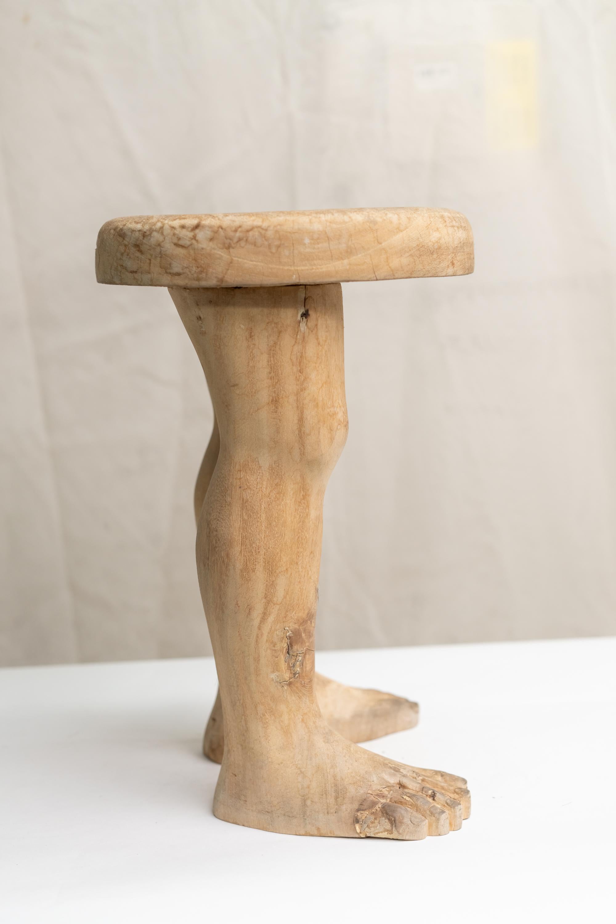 table with human legs
