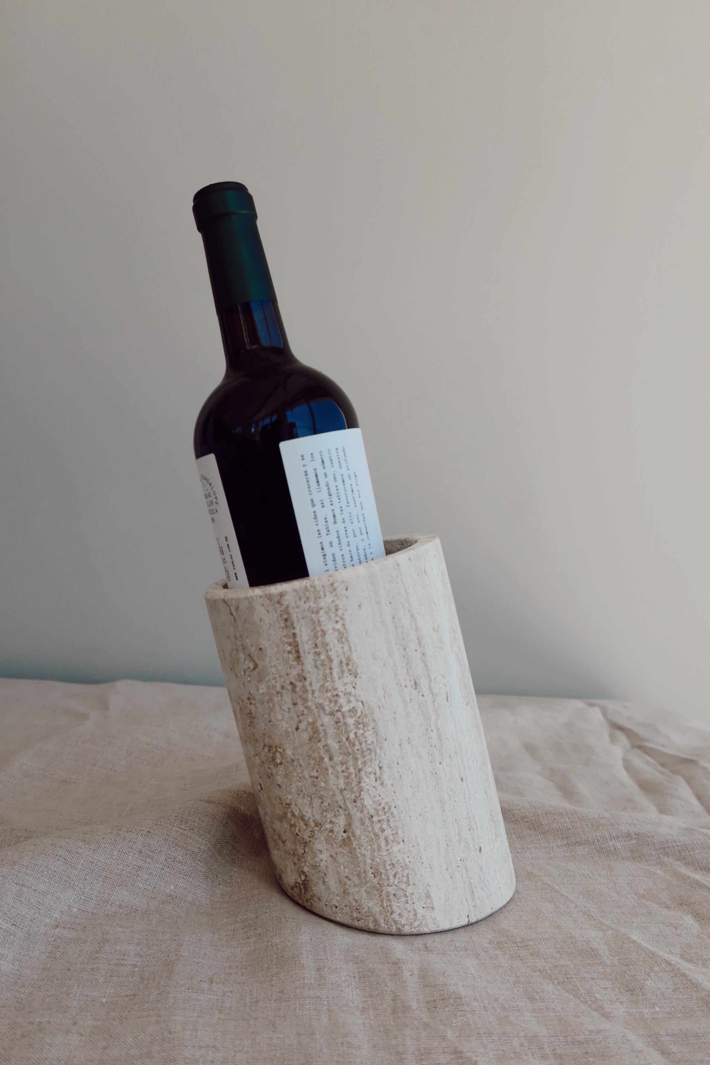 
A Mexican handcrafted marble bottle holder exudes elegance and practicality, elevating any dining experience. Meticulously crafted from exquisite Mexican marbles such as travertine, white Veneciano, black Queretaro, and gray Santo Tomas, this