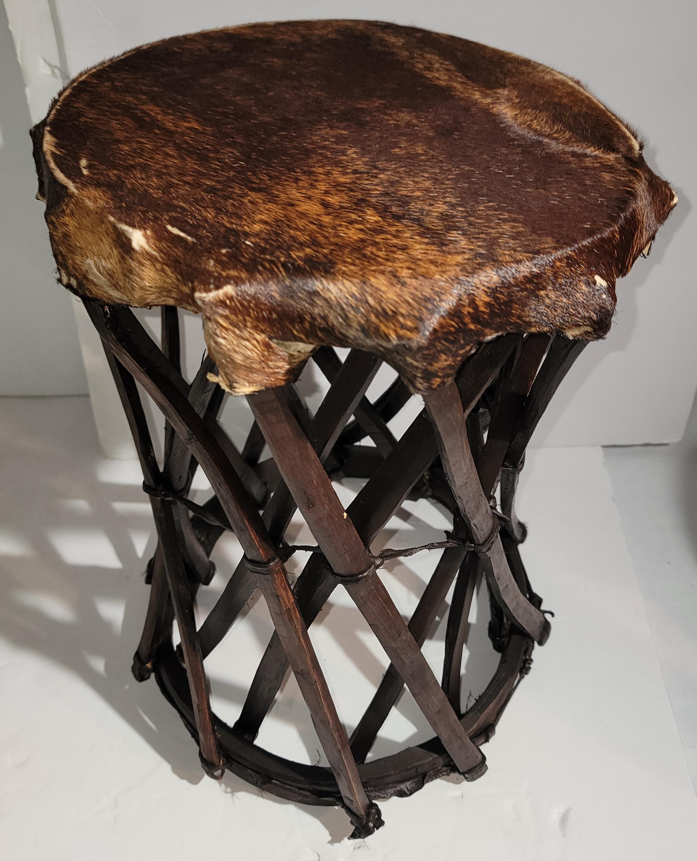 Amazing hand made construction stools covered in cow skin seats and hickory wood.Very strong & sturdy.Sold as a matched pair. Made in Mexico.
