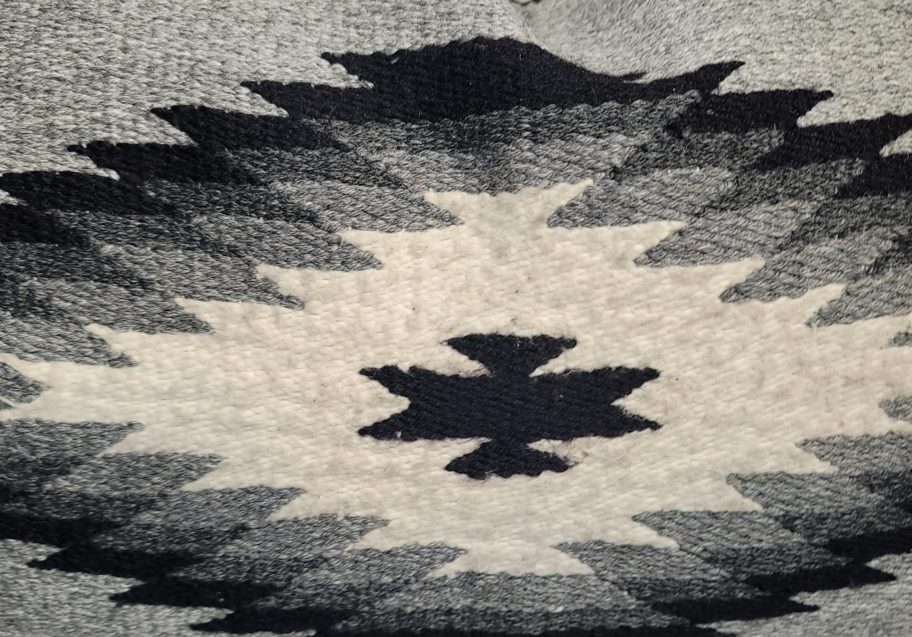 Mexican Indian weaving bolster pillow in an eye dazzler pattern.The insert is down Feather fill.