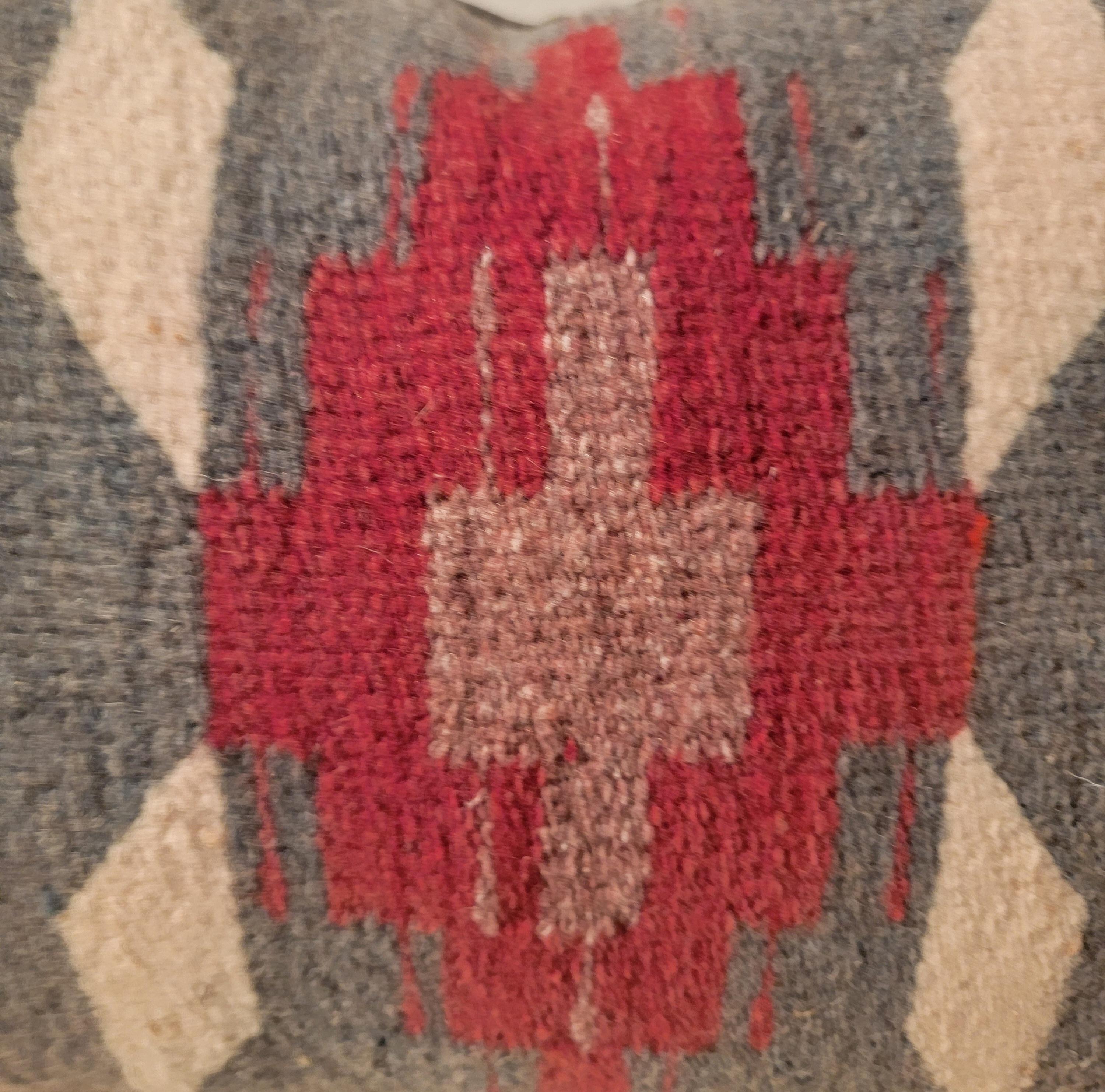 Mexican Indian weaving pillow with grey leather backing.The insert is down & feather fill.
