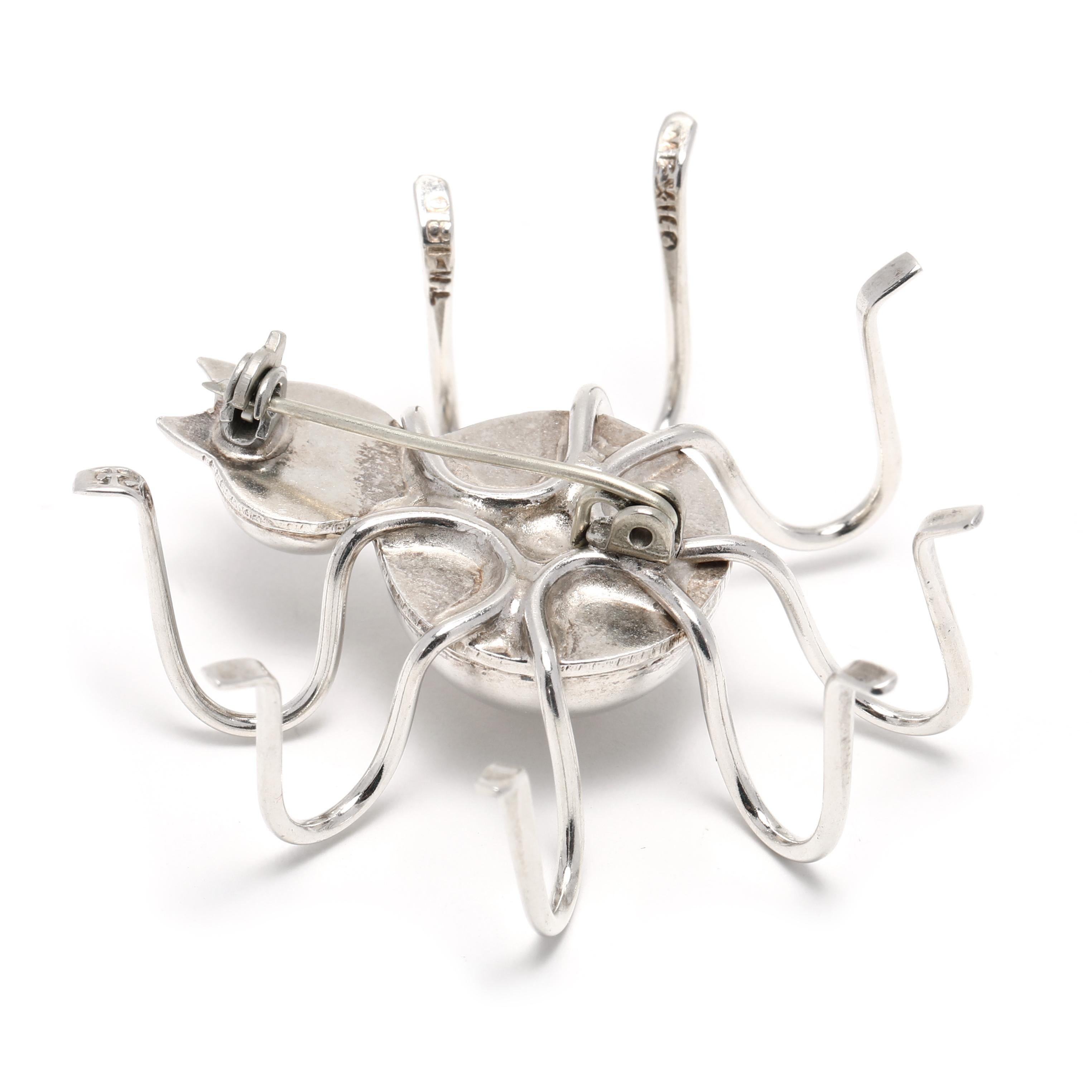 This spooky spider brooch is made from sterling silver and is the perfect addition to any wardrobe! The Mexican large spider brooch measures 2 inches in length and is sure to get attention. Its intricate design and highly detailed construction make