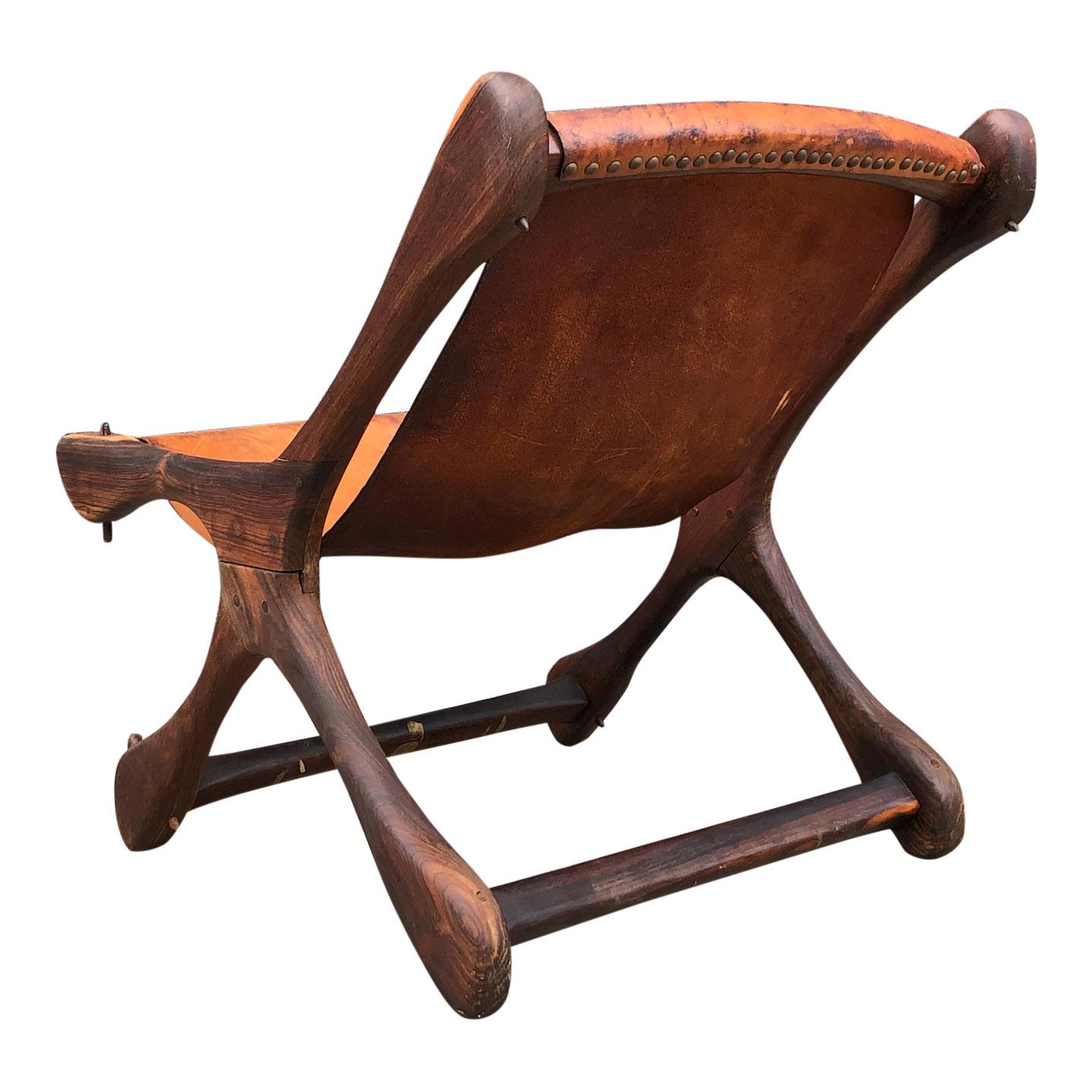 Wonderfully crafted lounge chair in rosewood / Cocobolo (one of the finest woods in the world). All original, some patina/cracking to the brown leather. Don S. Shoemaker is the most important and praised Mid-Century Modern furniture designer from