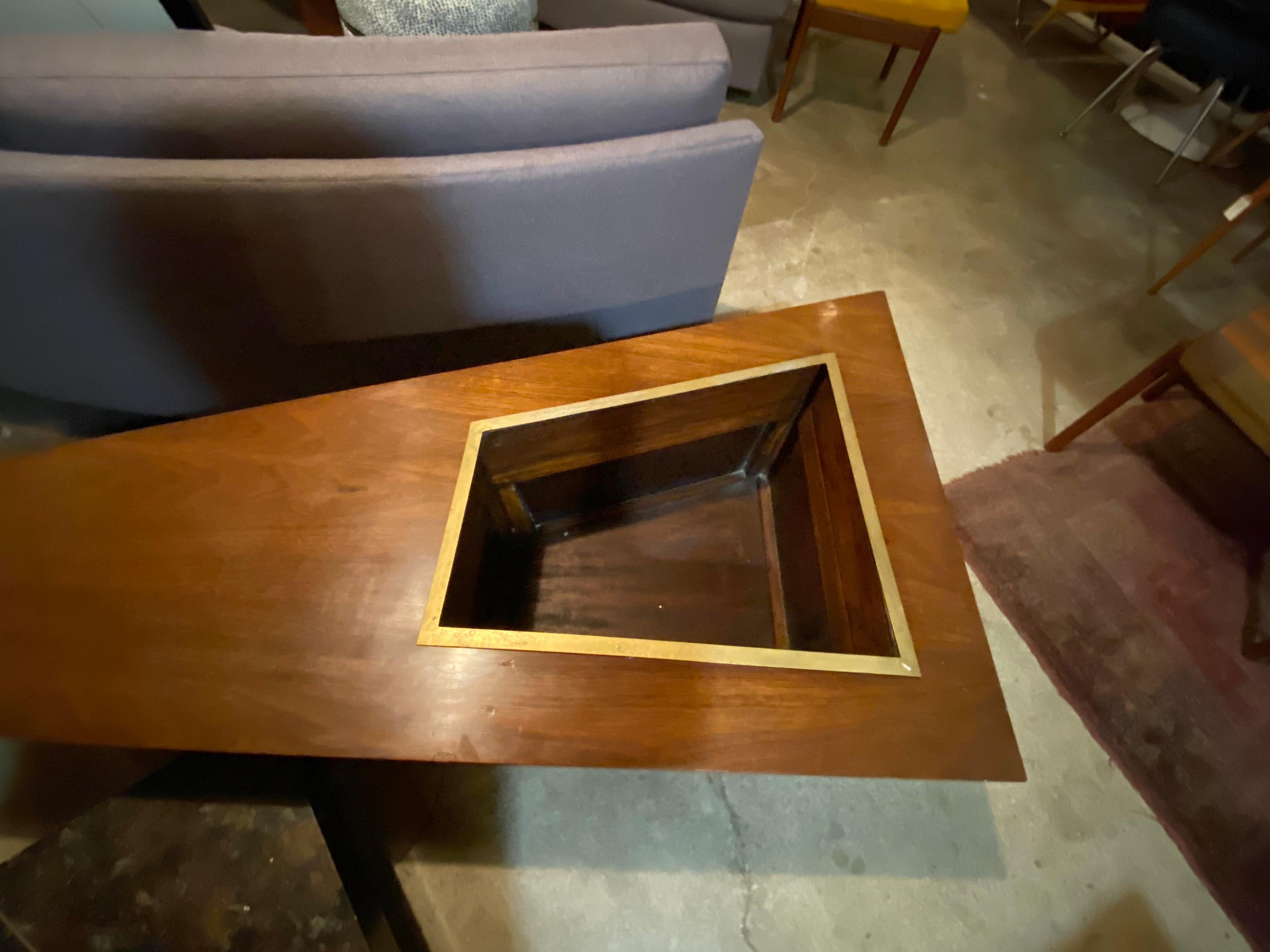 Beautiful vintage Eugenio Escudero mahogany coffee table with a built-in planter, also features a smaller table that sits below the main table that can be used separately or kept together for a unique sculptural piece. 

small table: 29.63