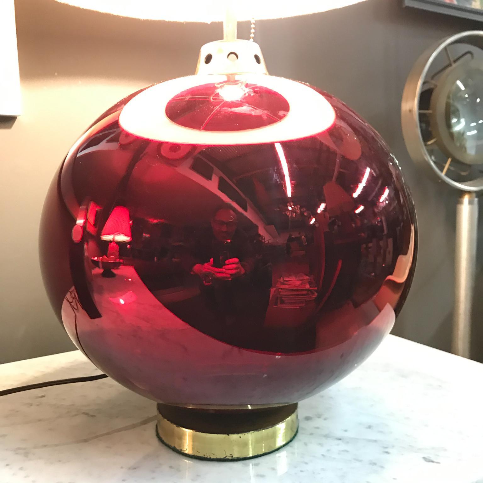 We are pleased to offer a unique table lamp, hand blown mercury glass in ruby red color. With patinated brass hardware. Rewired, tested and working with no issues. Shade for props only, shade not included with the lamp. Made in Mexico, circa 1950s.