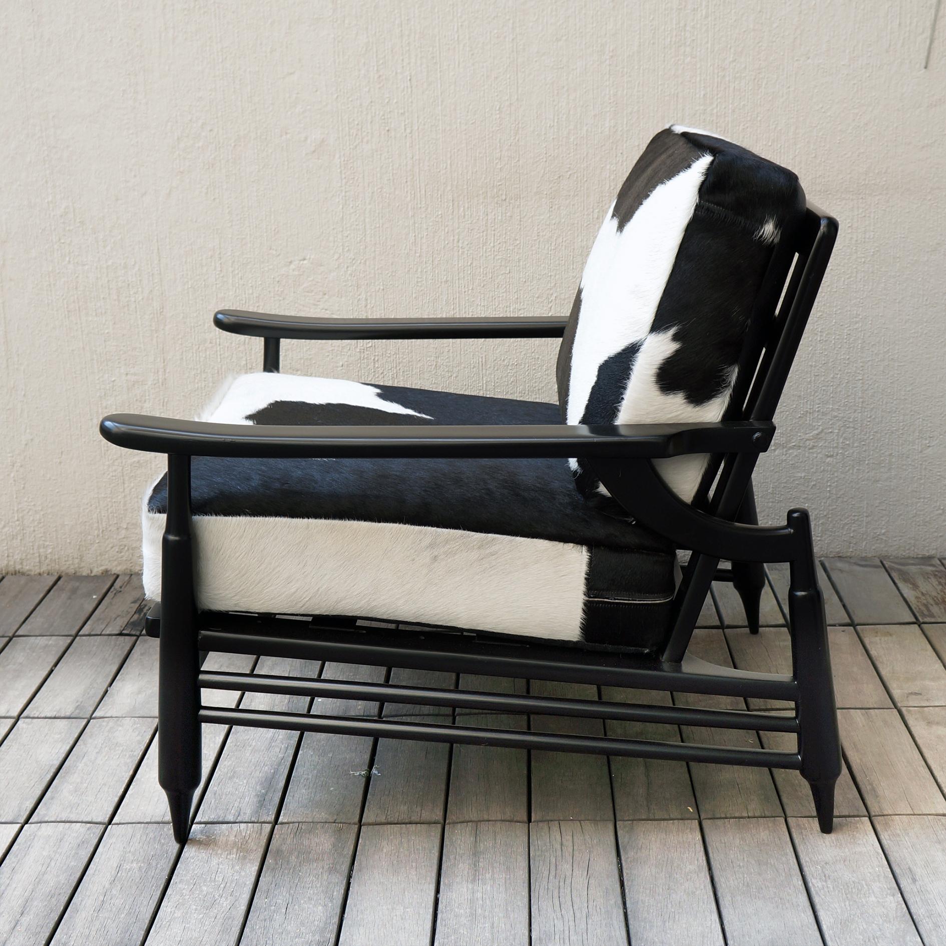 Unique piece. Lounge chair armchair created by Mexican artisans towards the mid-20th century. The piece has been restored in black lacquer paint and has natural leather (cow) seats.