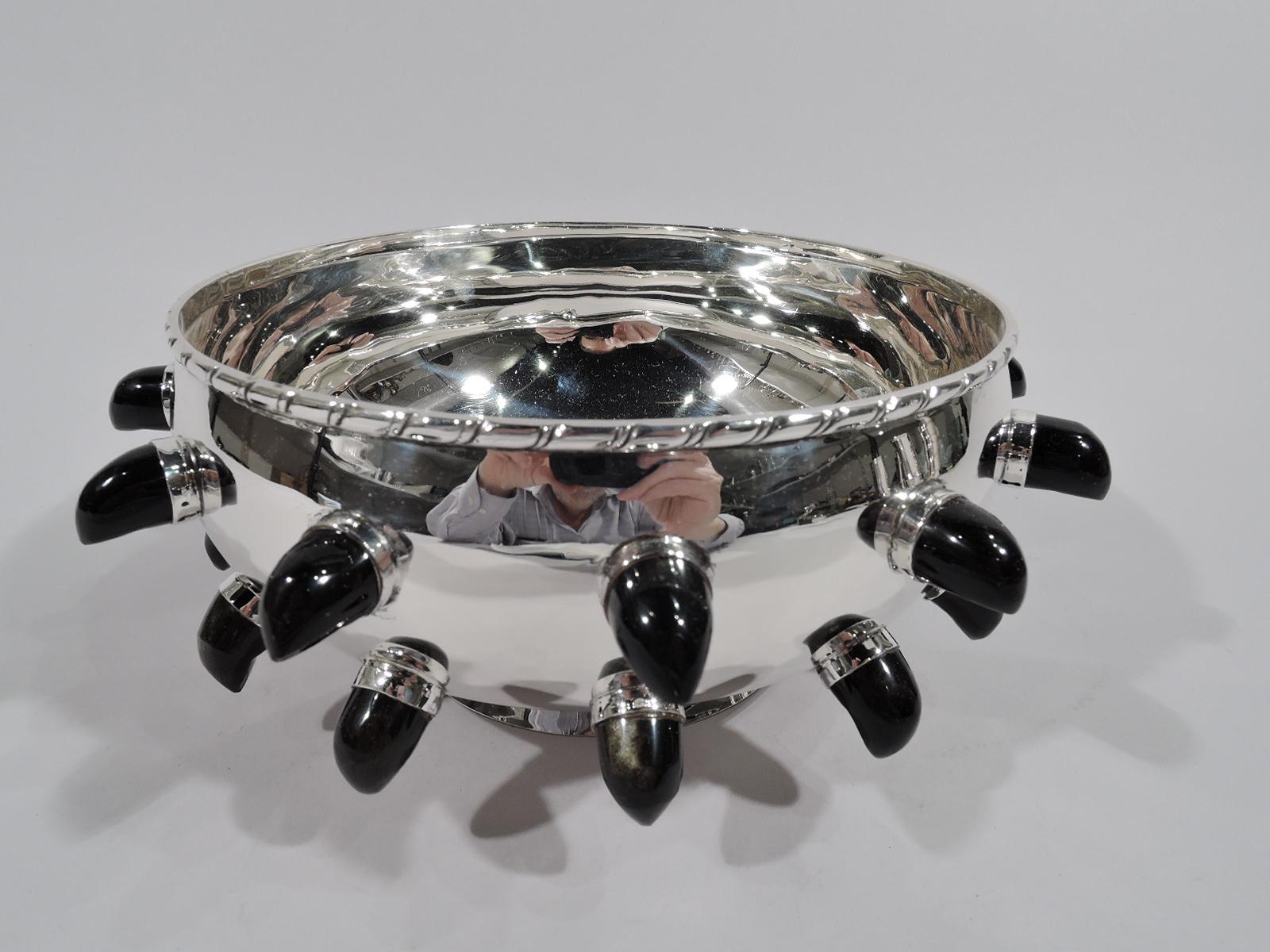 Mid-Century Modern sterling silver and obsidian bowl. Made by Tane in Mexico City. Curved bowl on short spread foot. Rim has tooled scoring. On exterior are obsidian “teardrops” sterling silver mounts. Fully marked including maker’s stamp and no. 71