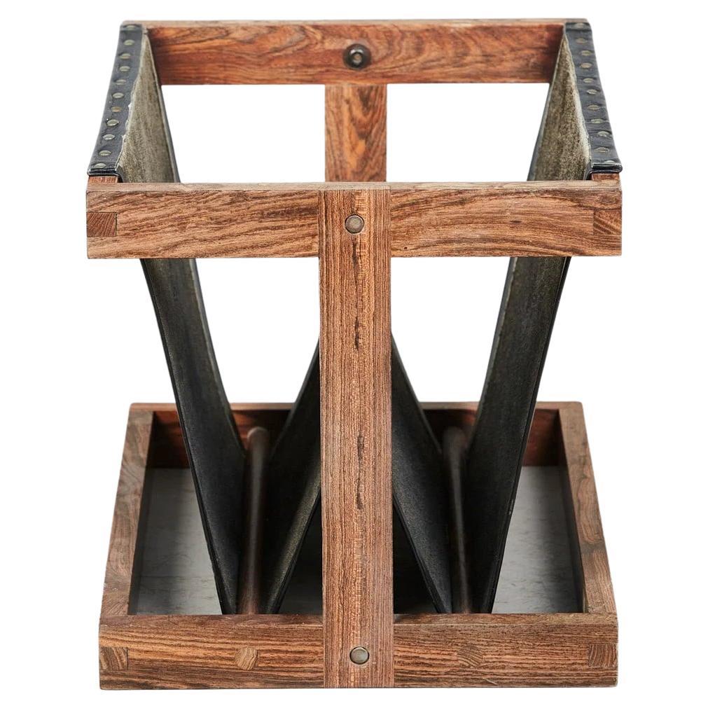 Label: Señal S.A.Hecho en Mexico.

Cocobolo wood and black leather mid-century modern magazine rack from the sixties. The leather has a beautiful sensual feel and is in excellent condition. The cocobolo gives it a warm yet unique look with its