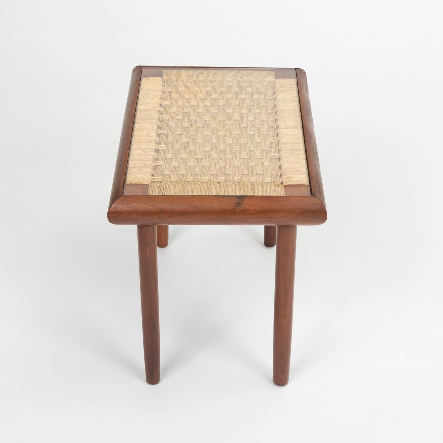 Bauhaus-trained, Mexico City-based Michael van Beuren created highly functional modern design inspired by Mexican vernacular styles and materials. This example is a side table with a rectangular teak frame. The under-frame of the table is strung
