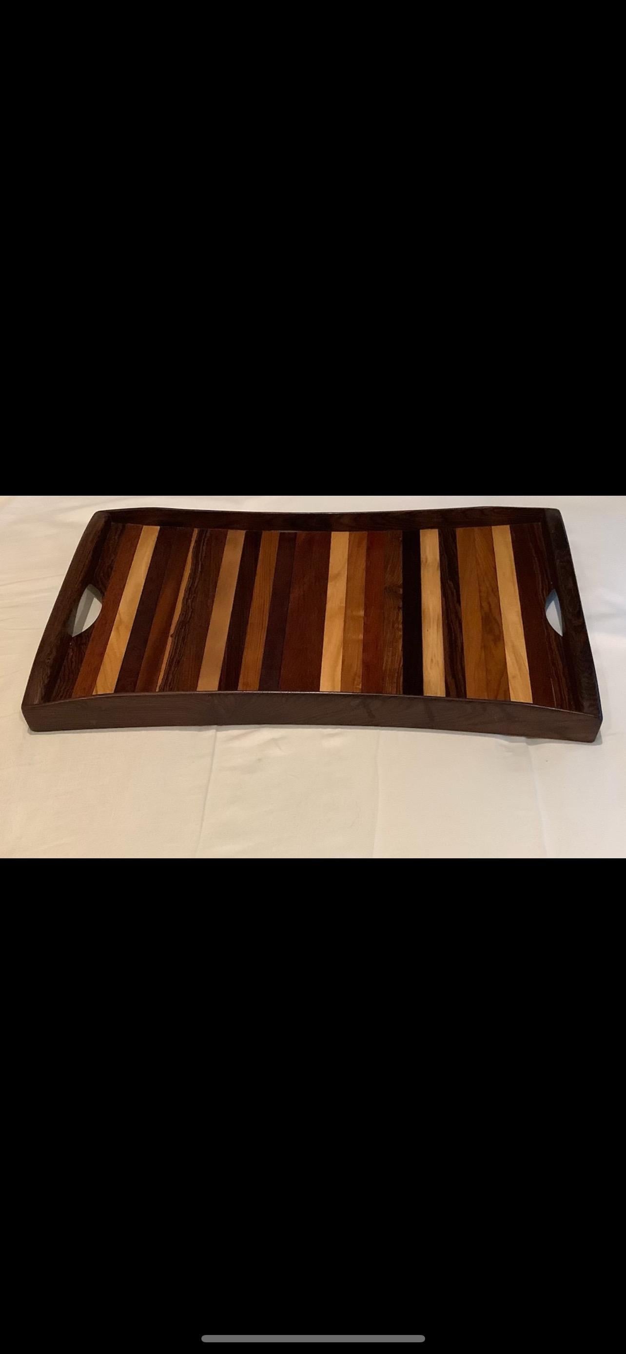 Mexican Modern Wood Tray By Don S. Shoemaker.
Offered is a beautiful Mexican modern tray with handles by Don Shoemaker. Made for Señal S.A. from Cocobolo Wood which is a Mexican rosewood.    This decorative Mexican mid century wood tray can also be