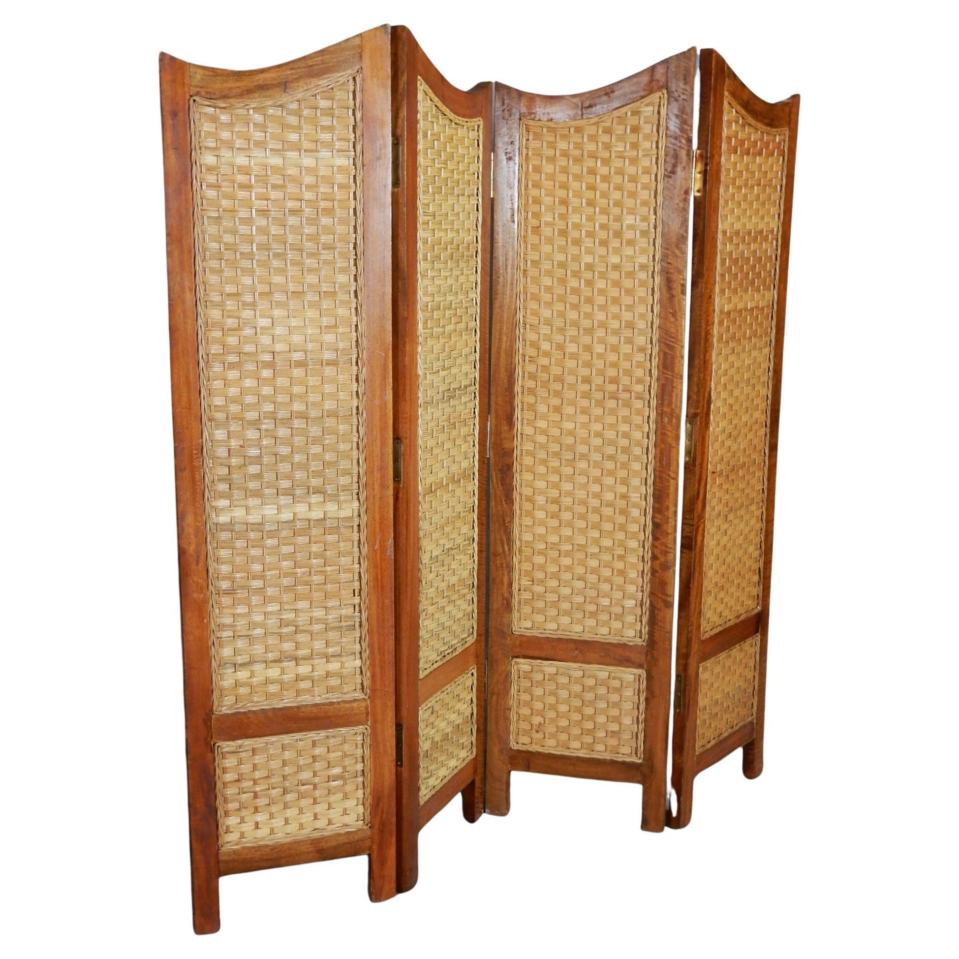 Exotic hardwood room divider, privacy screen with woven rattan cane panels.
Mexican modernism style with swooping top rails. Gorgeous grained wood with a gloss finish.
4 triple hinged panels each 16