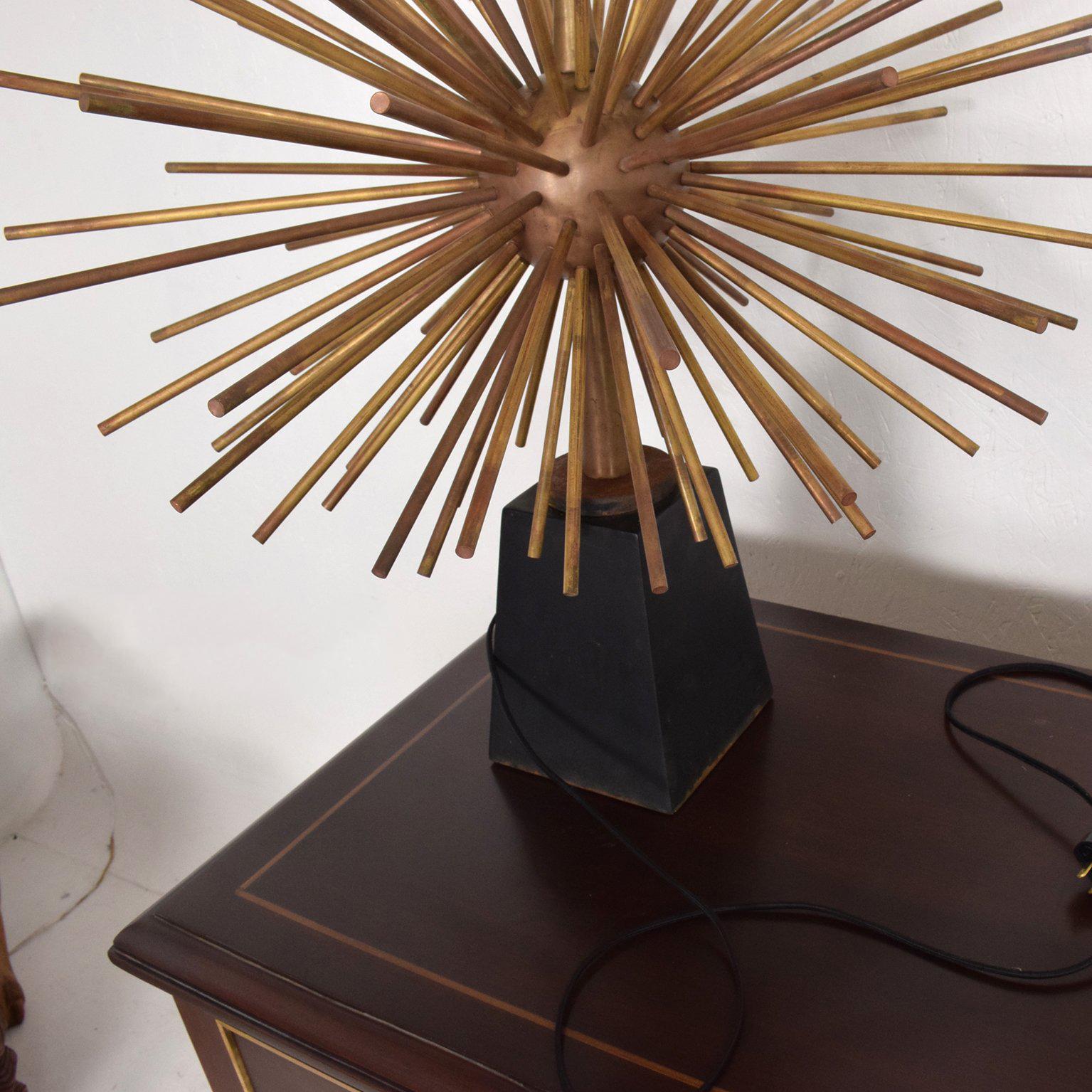 For your consideration a pair of table lamps attributed to Arturo Pani. 

Starburst shape in solid bronze with base in aluminum painted in black.

Lamps have been rewired and are ready to go.
Lampshade not included, for props only.

Measures: