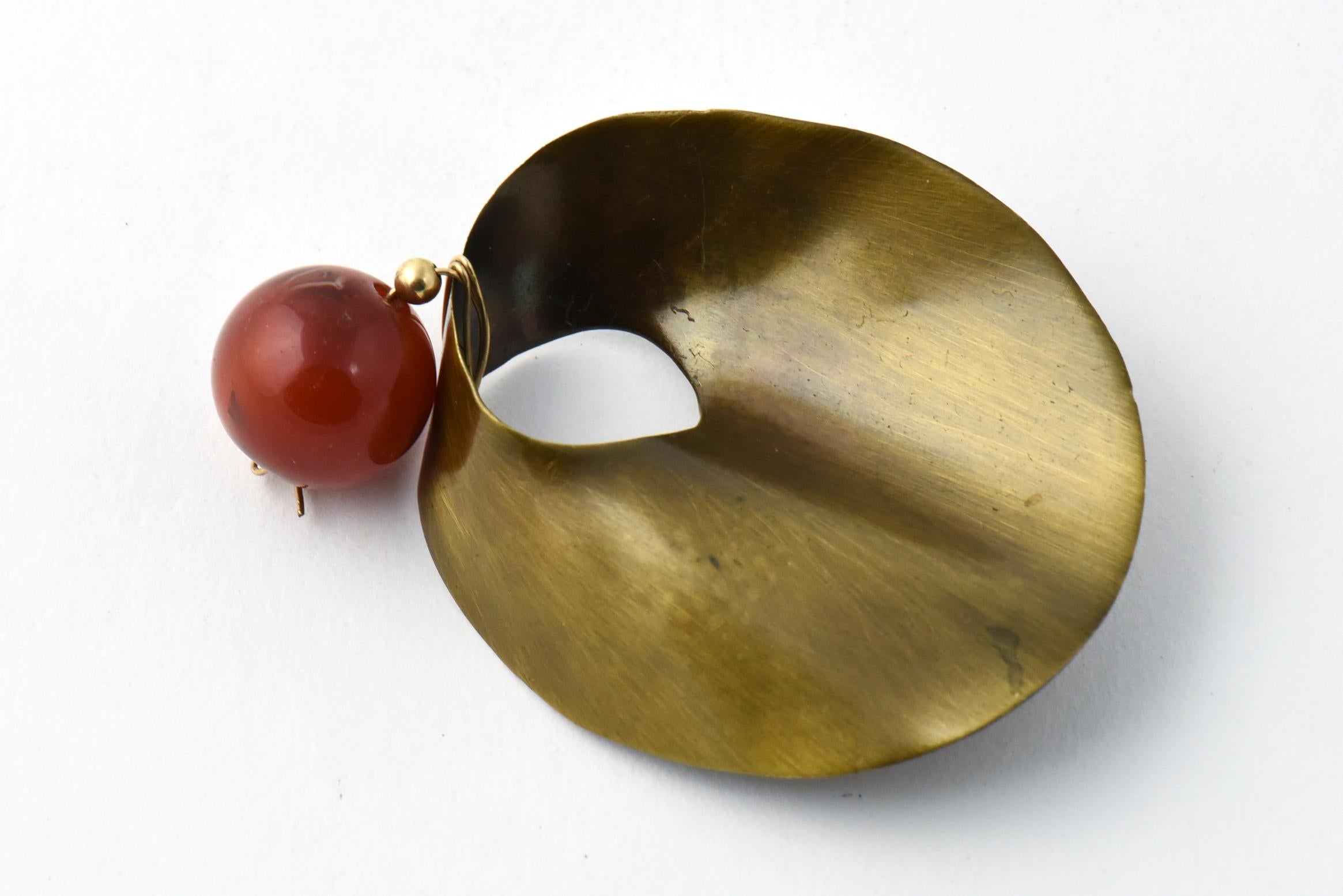 Dramatic Modernistic Mexican Sterling Silver Brooch with a brass finish dangling a Carnellian ball accent.
