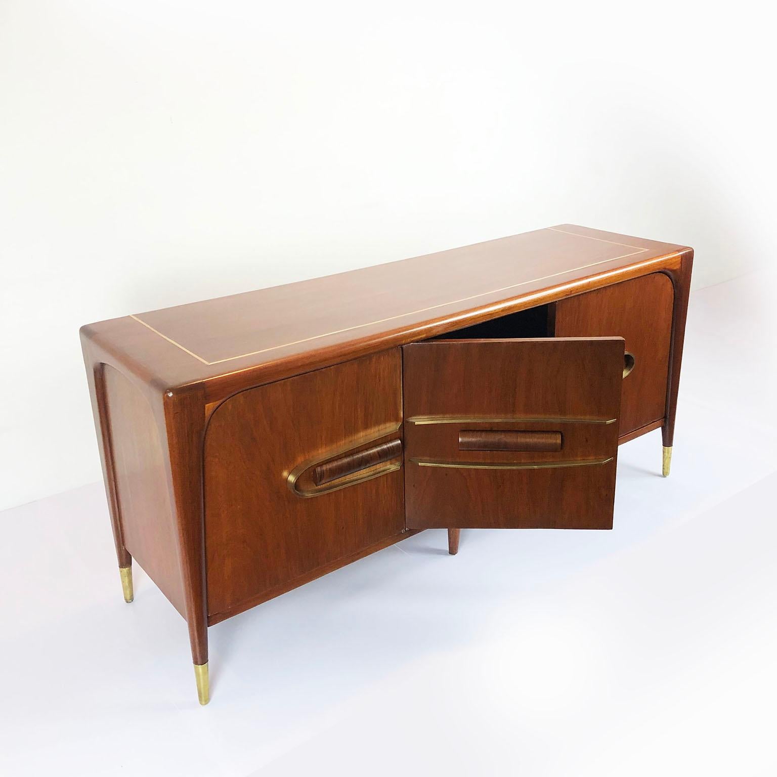 We offer a Mexican modernist long credenza in solid mahogany wood frame, with brass accents and solid mahogany pull handles, circa 1960. Recently restored.