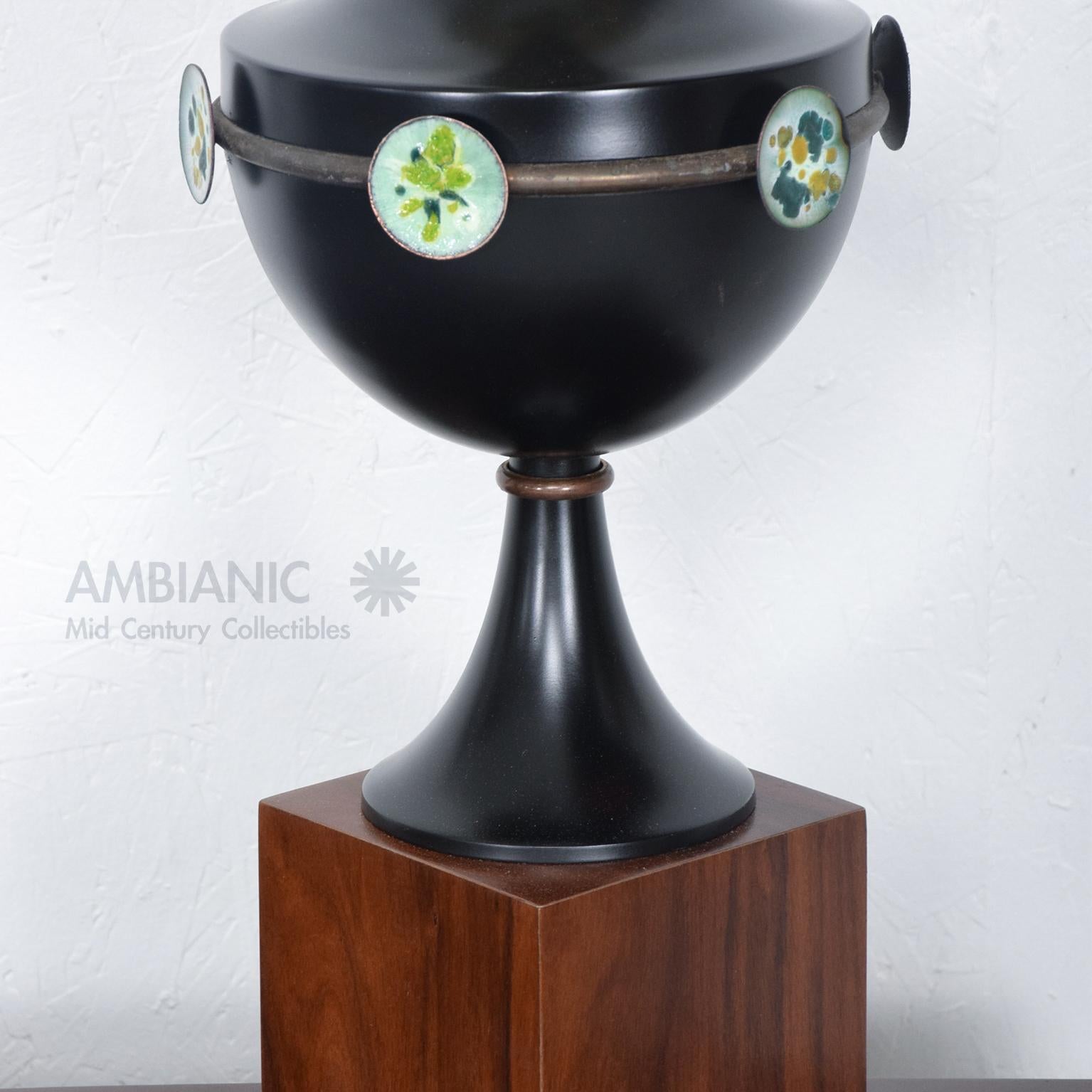 Mexican Modernism Fabulous Sculptural Table Lamp. Aluminum painted black. Fittings and hardware in patinated bronze.
Lamp features colorful enamel disc plates.  Lamp is mounted on elevated walnut rosewood base.
No information on maker. Similar to