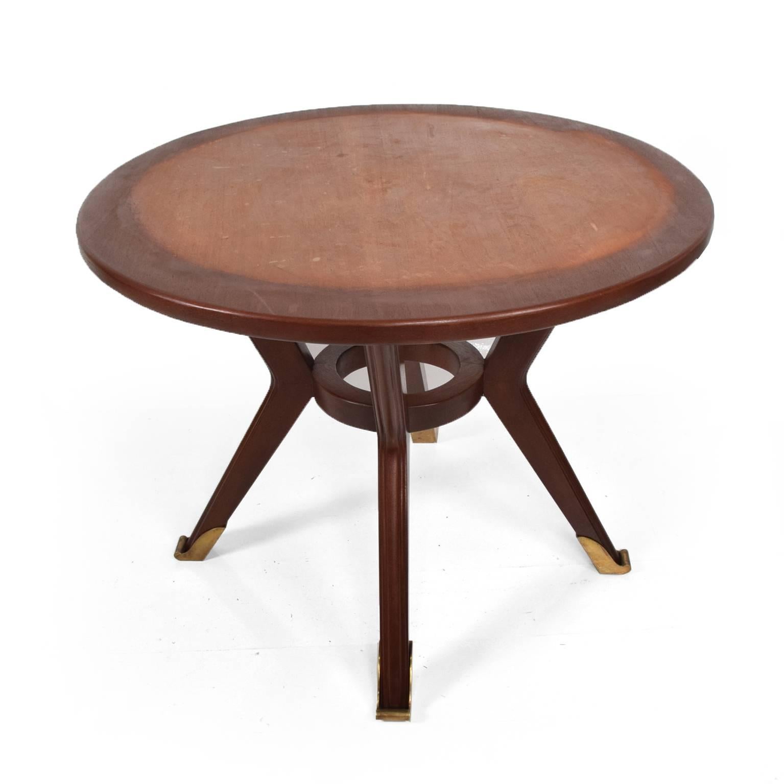 For your consideration, a sculptural dining table in mahogany wood with sculptural brass sabots, 
Mexico, circa 1950s. 
The table has a marble top (not in the picture).
Dimensions: 29 5/8