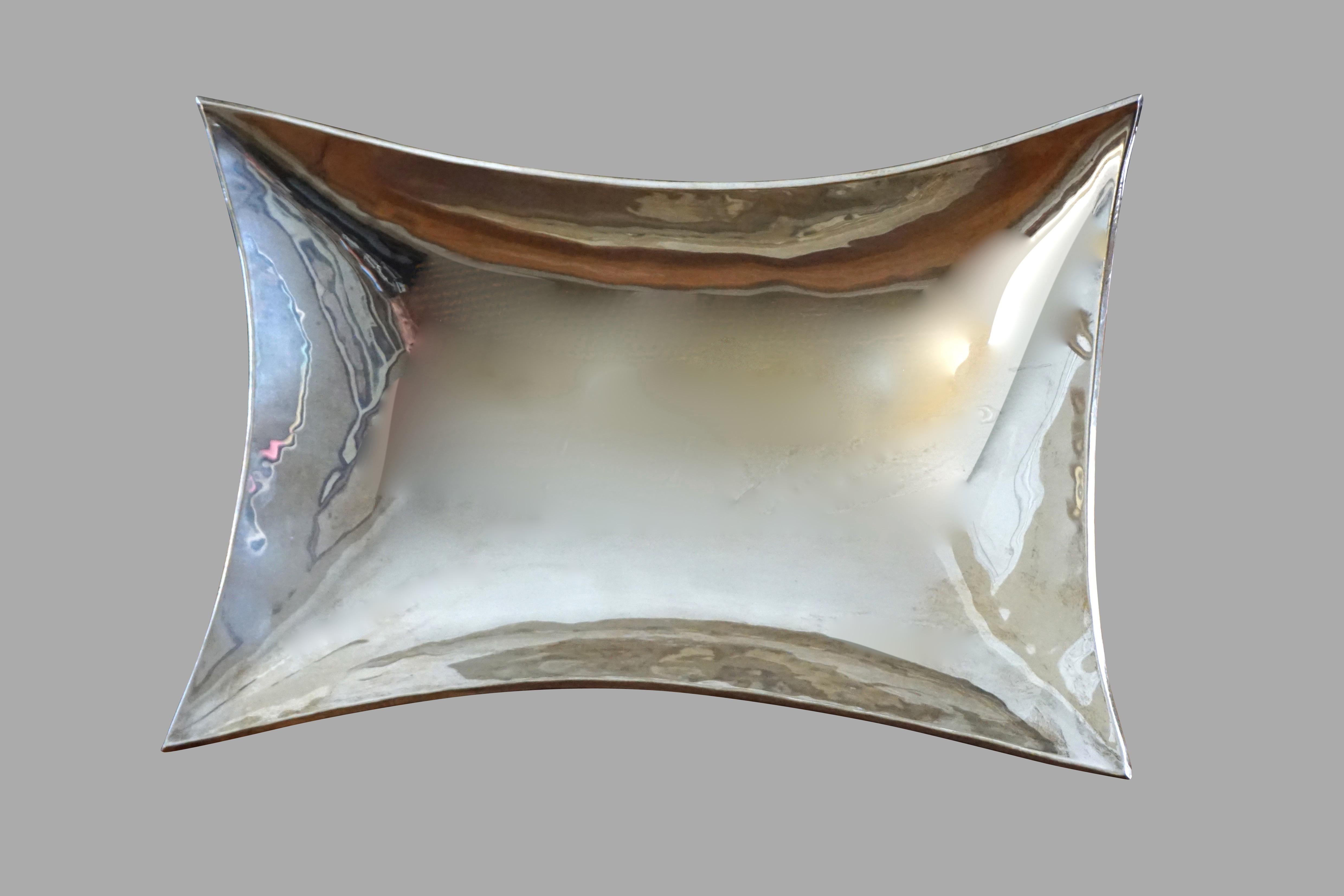 An elegant Mexican modernist sterling silver footed dish. Weight 15.6 troy oz. Stamped .925 AVM within triangle, circa 1965.