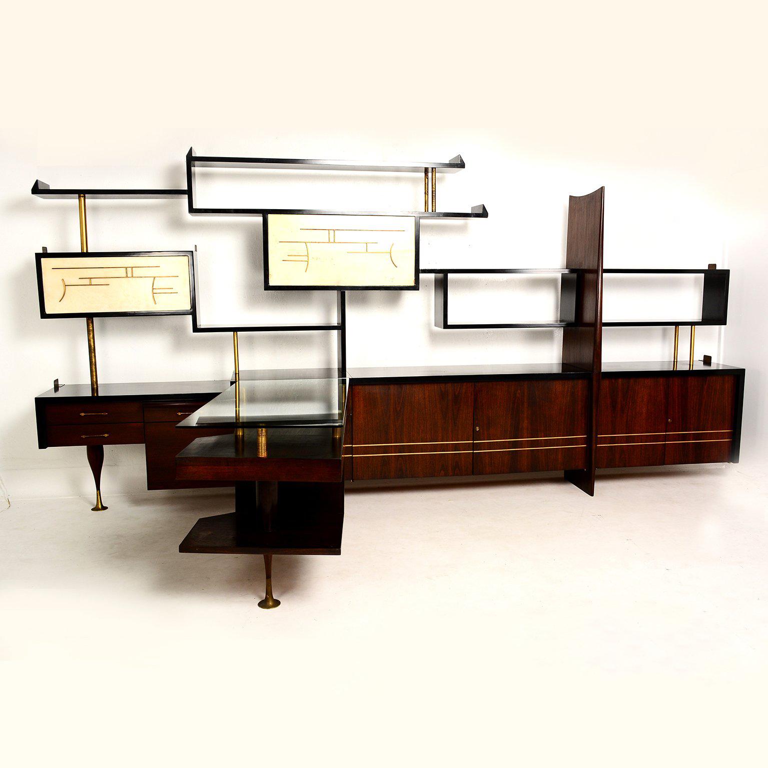 For your consideration a beautiful custom made wall unit with built in desk. Attributed to Eugenio Escudero, Mexico City Circa 1950s.

Features a corner desk with new glass top (3/8