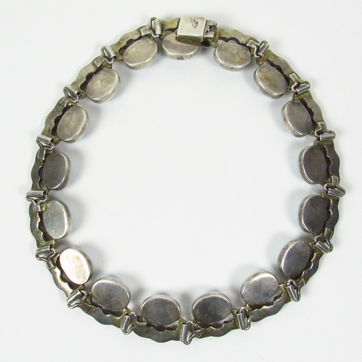 Very rare Mexican sterling silver choker style collar necklace comprised of seventeen silver links with oval Murano glass faux turquoise pieces. Stamped 
