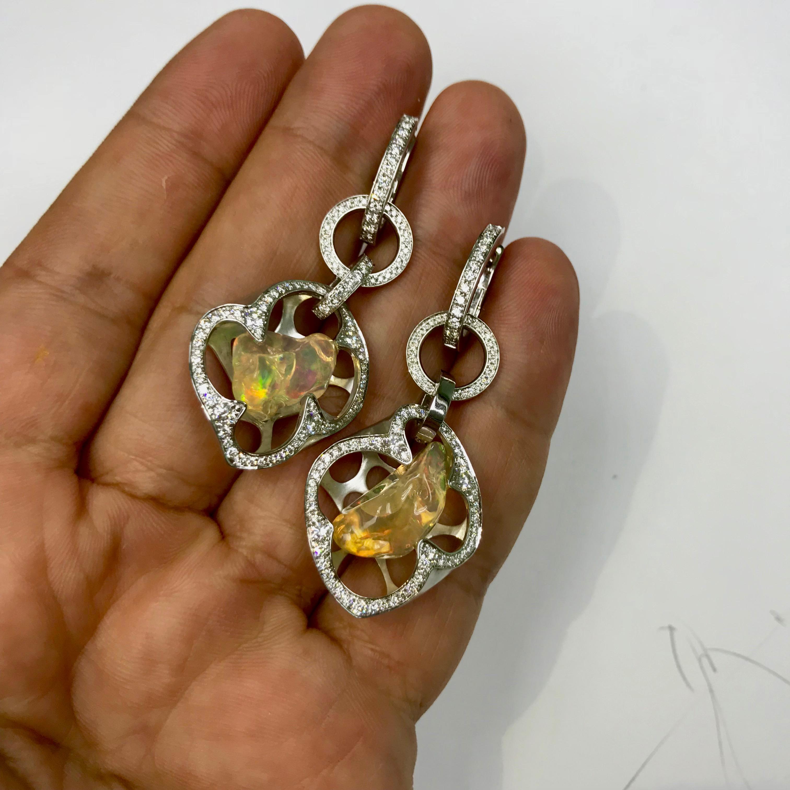 Free Shape Mexican Opal makes this earings One of a kind. Diamonds are support the play of colors. 
Can be wear without dangling part also. 18 Karat White Gold earrings
Accompanied by the ring LU116414707841

23.6x54x11 mm
17.15 gm 