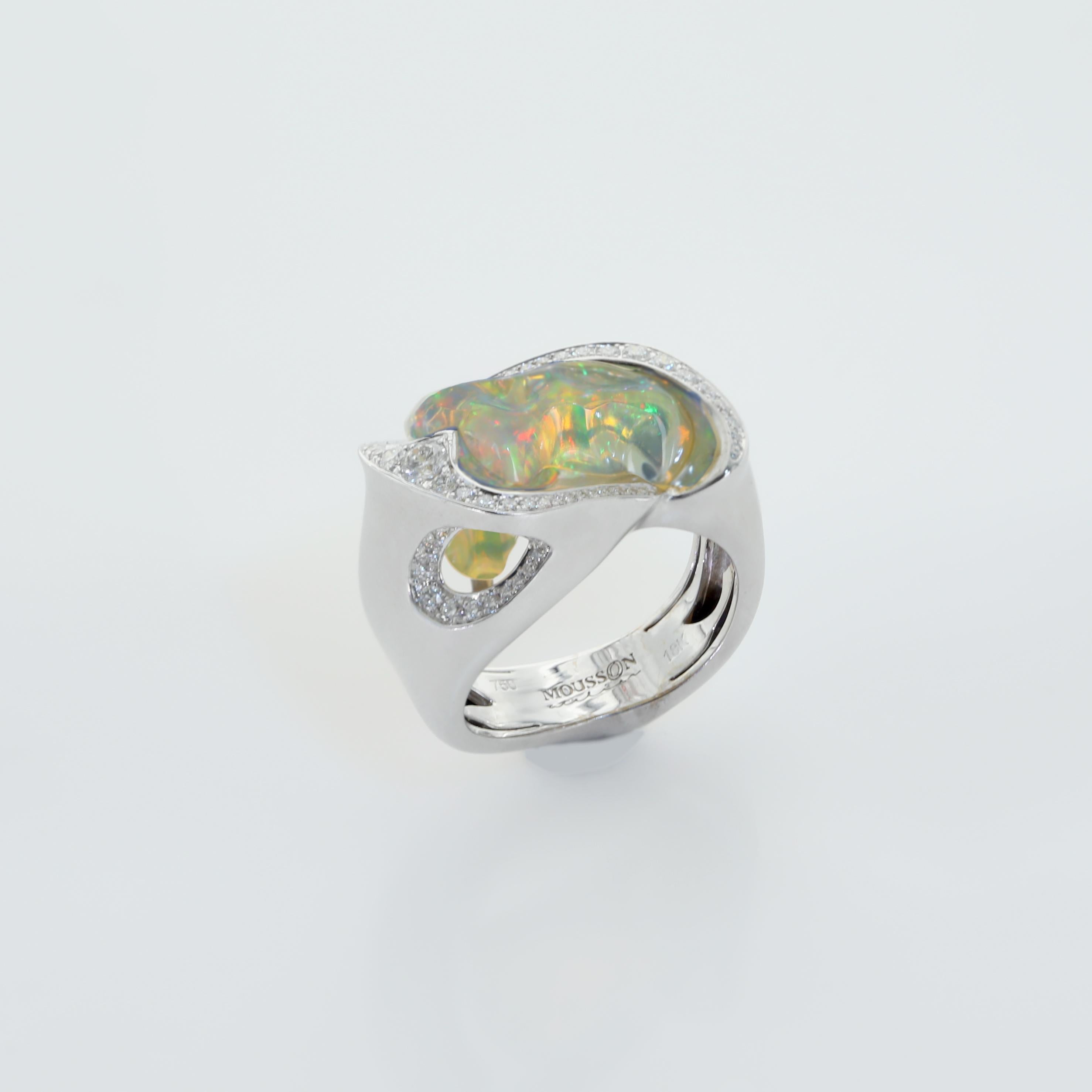 Free Shape Mexican Opal makes this ring One of a kind. Diamonds are supported the play of colors. 18 Karat White Gold Ring
Accompanied with earrings LU116414707821 

US Size 7 3/4
EU Size 55 7/8

23x14.5x32.6 mm
10.93 gm