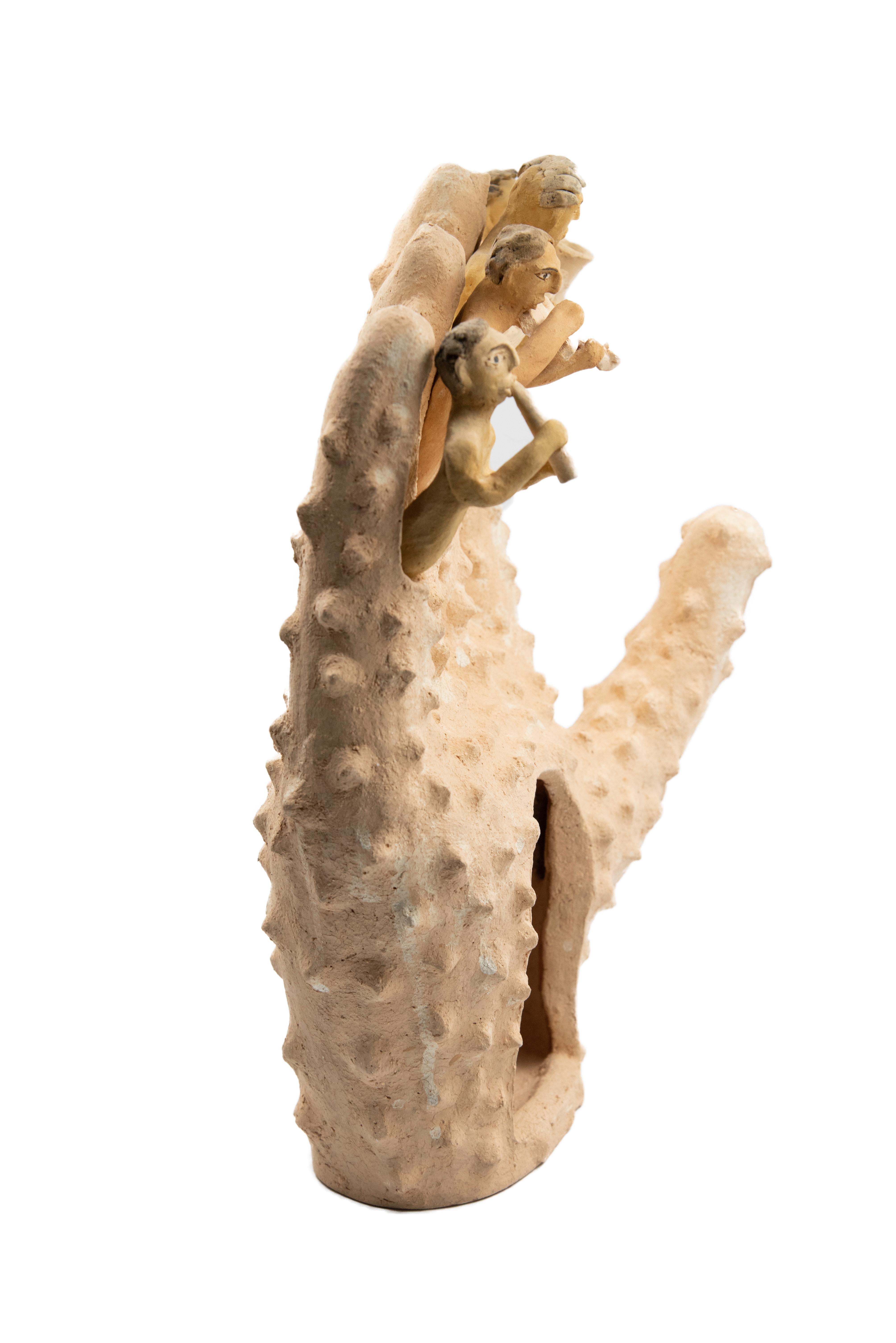 This Mexican ceramic clay hand sculpture is a piece by artist Manuel Reyes. Made with clay from Oaxaca and Zacatecas, painted with oxides from the region. Done with the hand-modeled technique and cooked in traditional wood-fired oven. 

Inspired